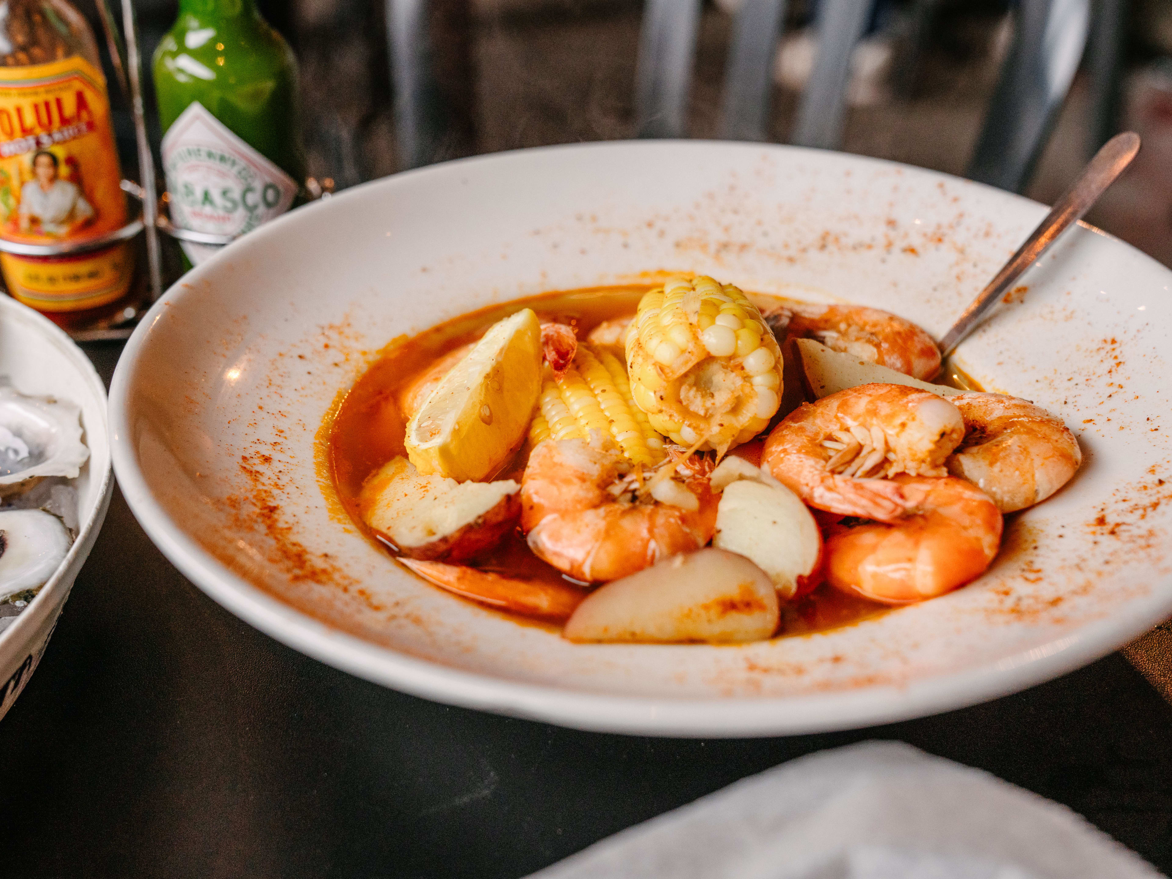 A low country boil with shrimp, potatoes, and corn.