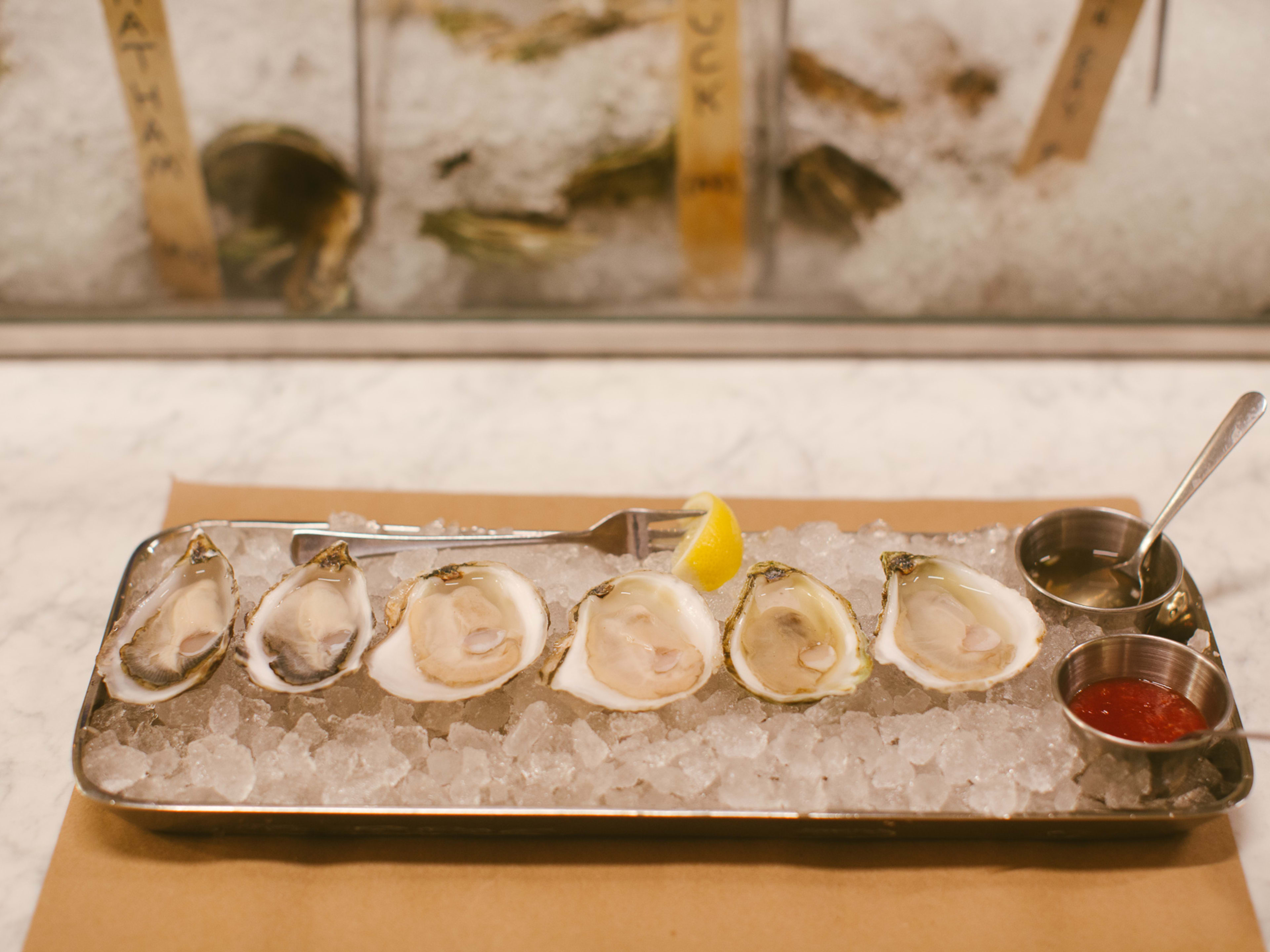 A row of oysters on ice from Greenpoint Fish & Lobster.