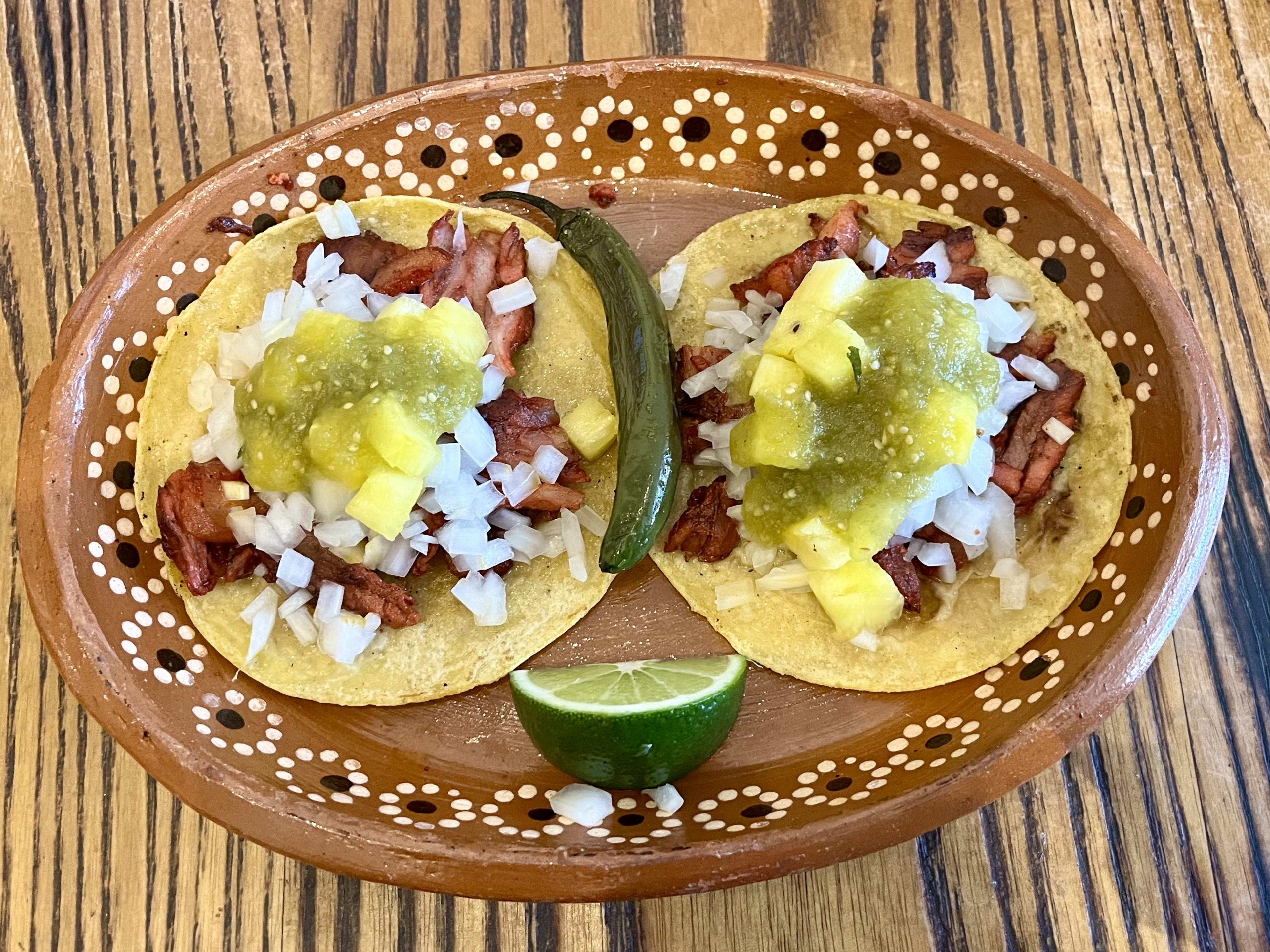 Two tacos Al Pastor at El Rey Taquiza Artesenal.