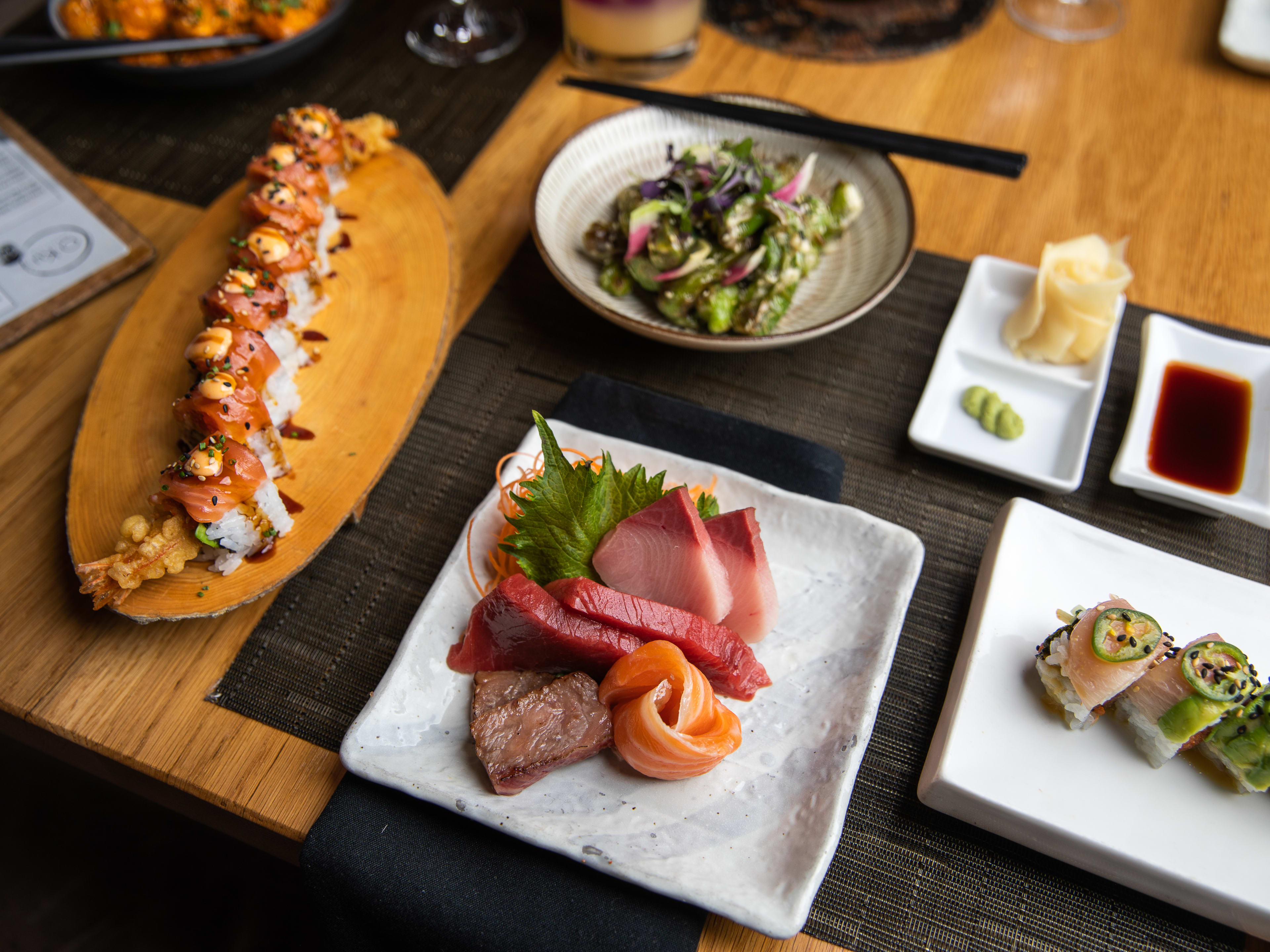 Spread of sushi dishes at O-Ku