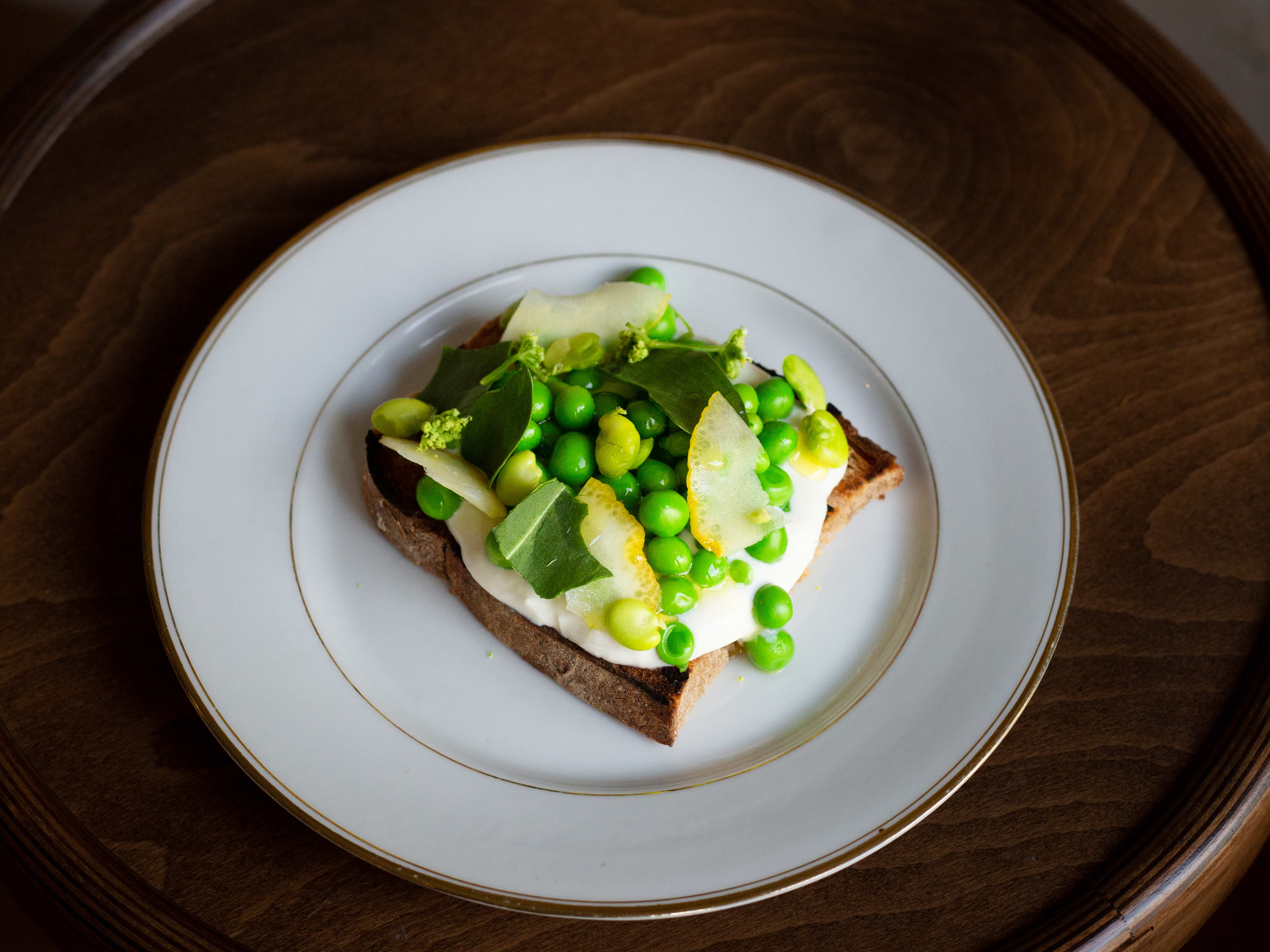 Green pea dish on toast at Gramme Paris