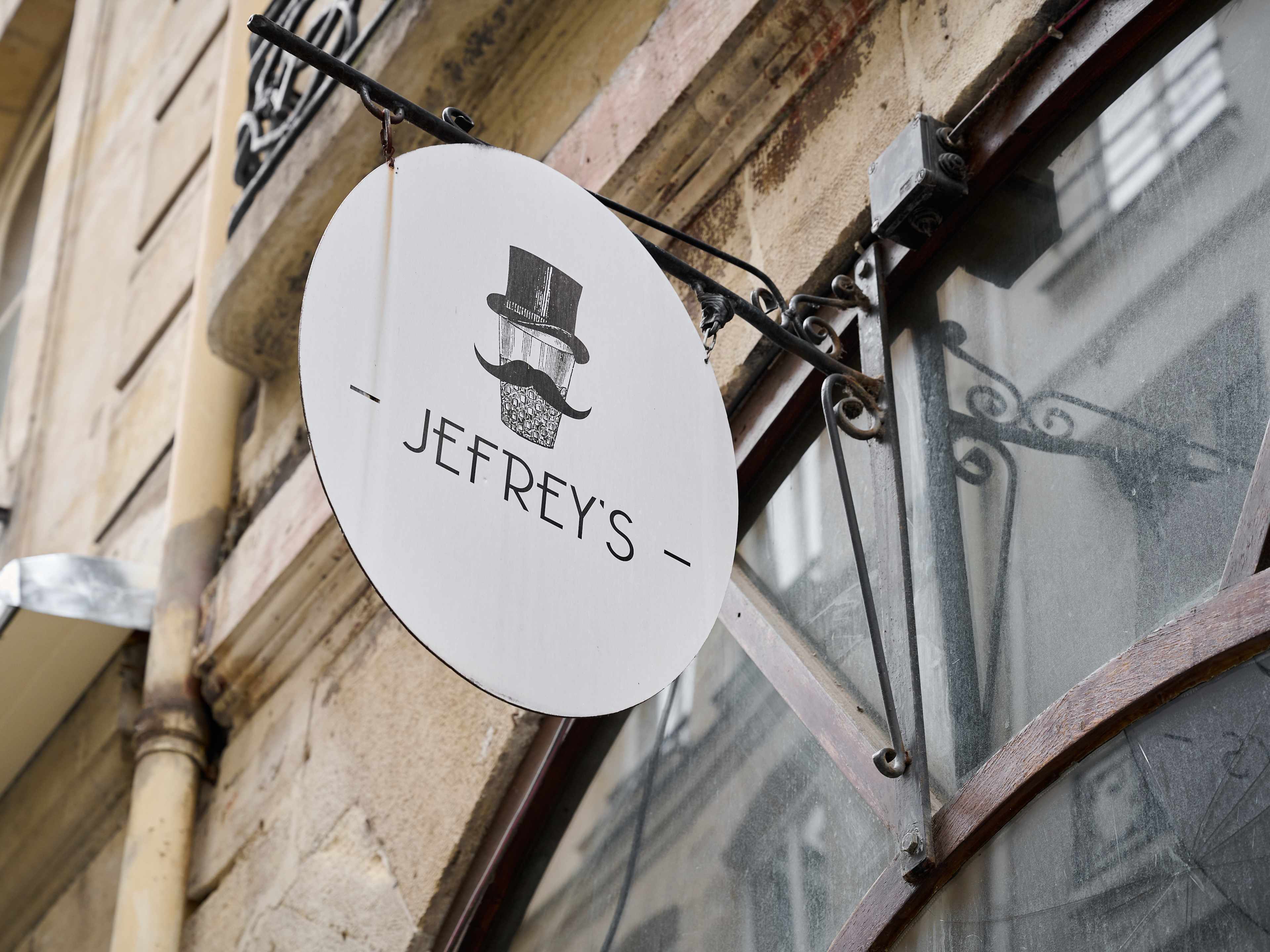 Exterior of Jefrey's with white and black signage