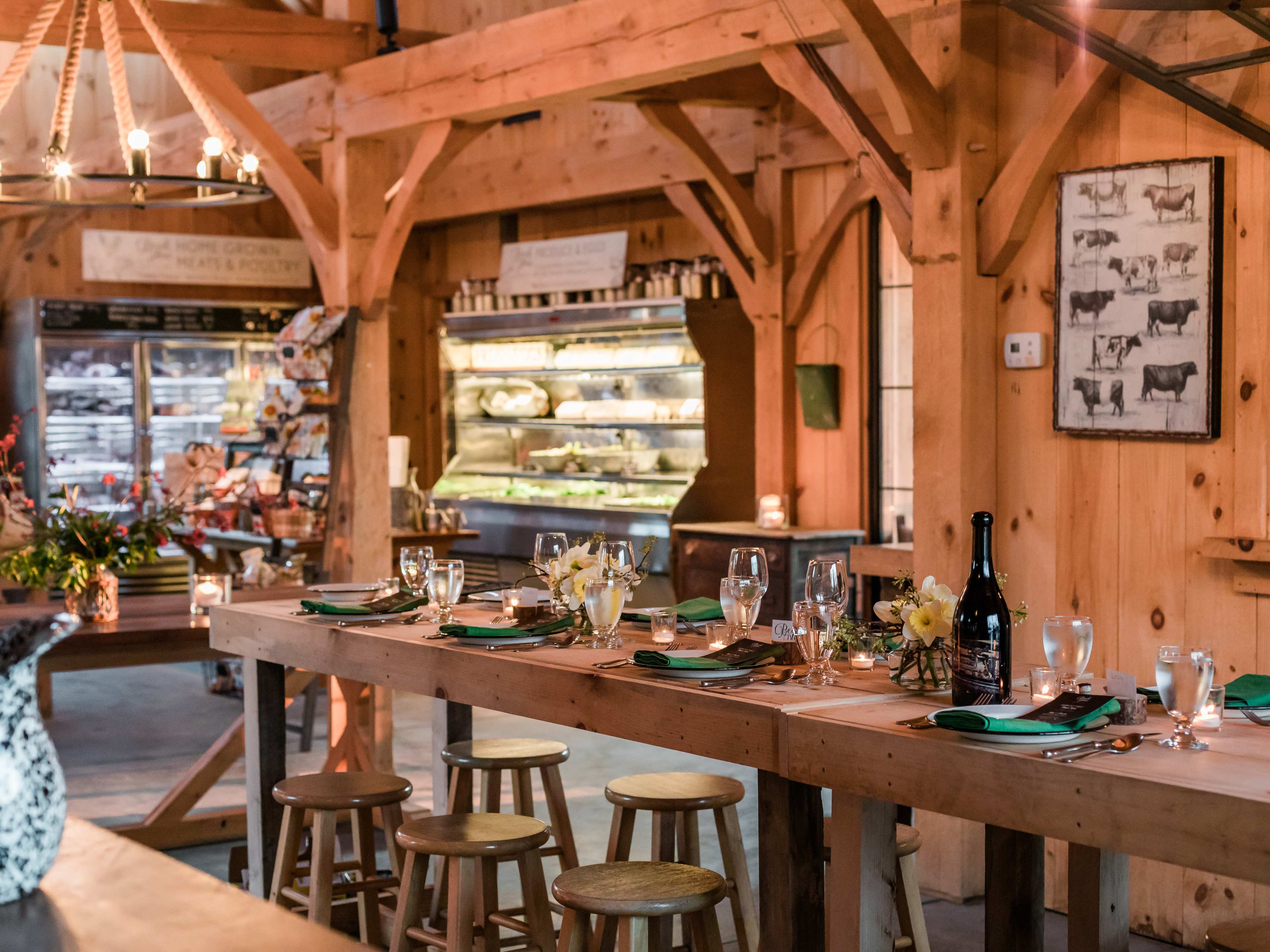 interior of farm store with refrigerators and a long communal table