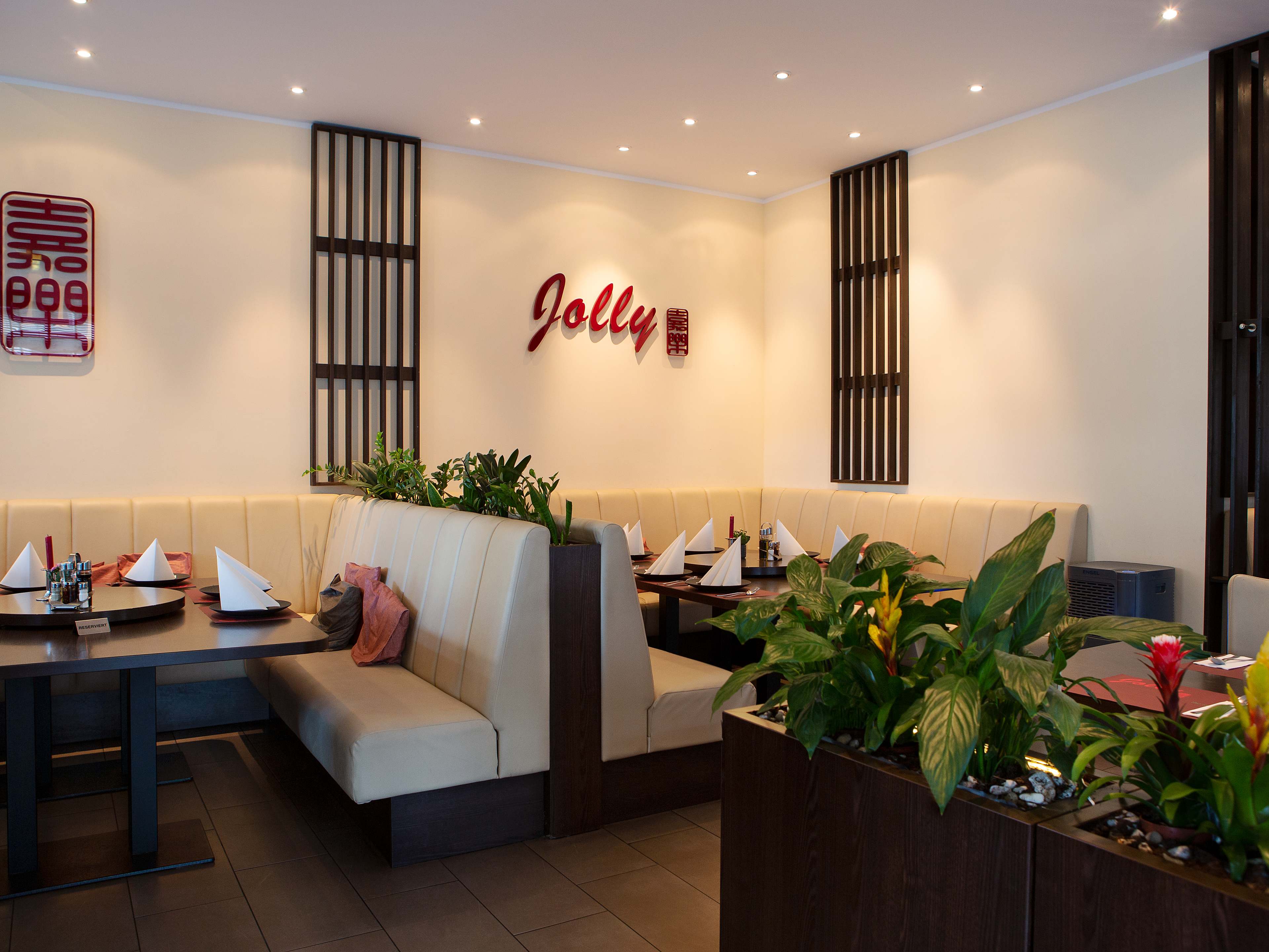 Interior dining space with dark wooden accents at Jolly