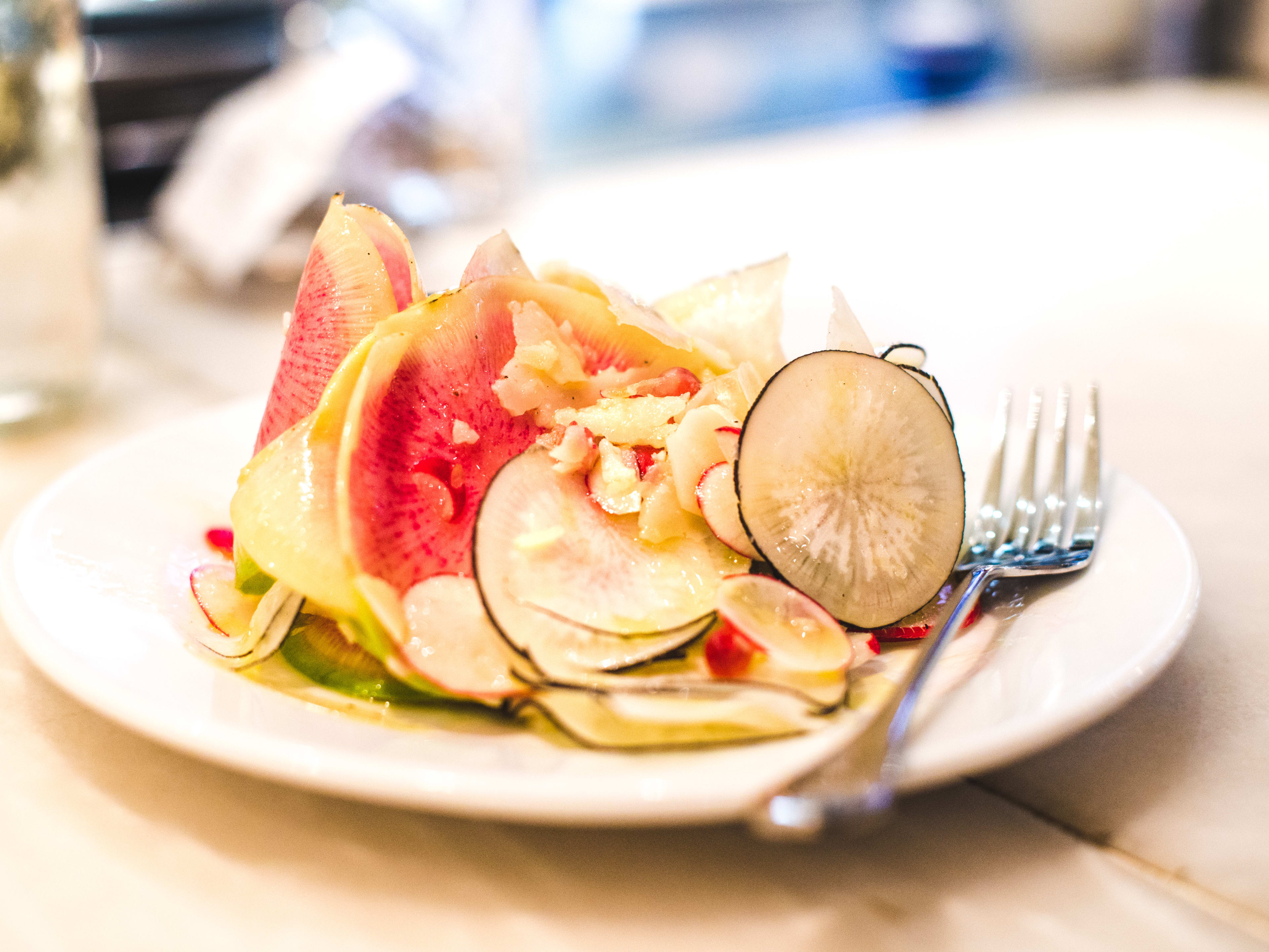 A plate of truffle and radish salad from Bocca Di Lupo.