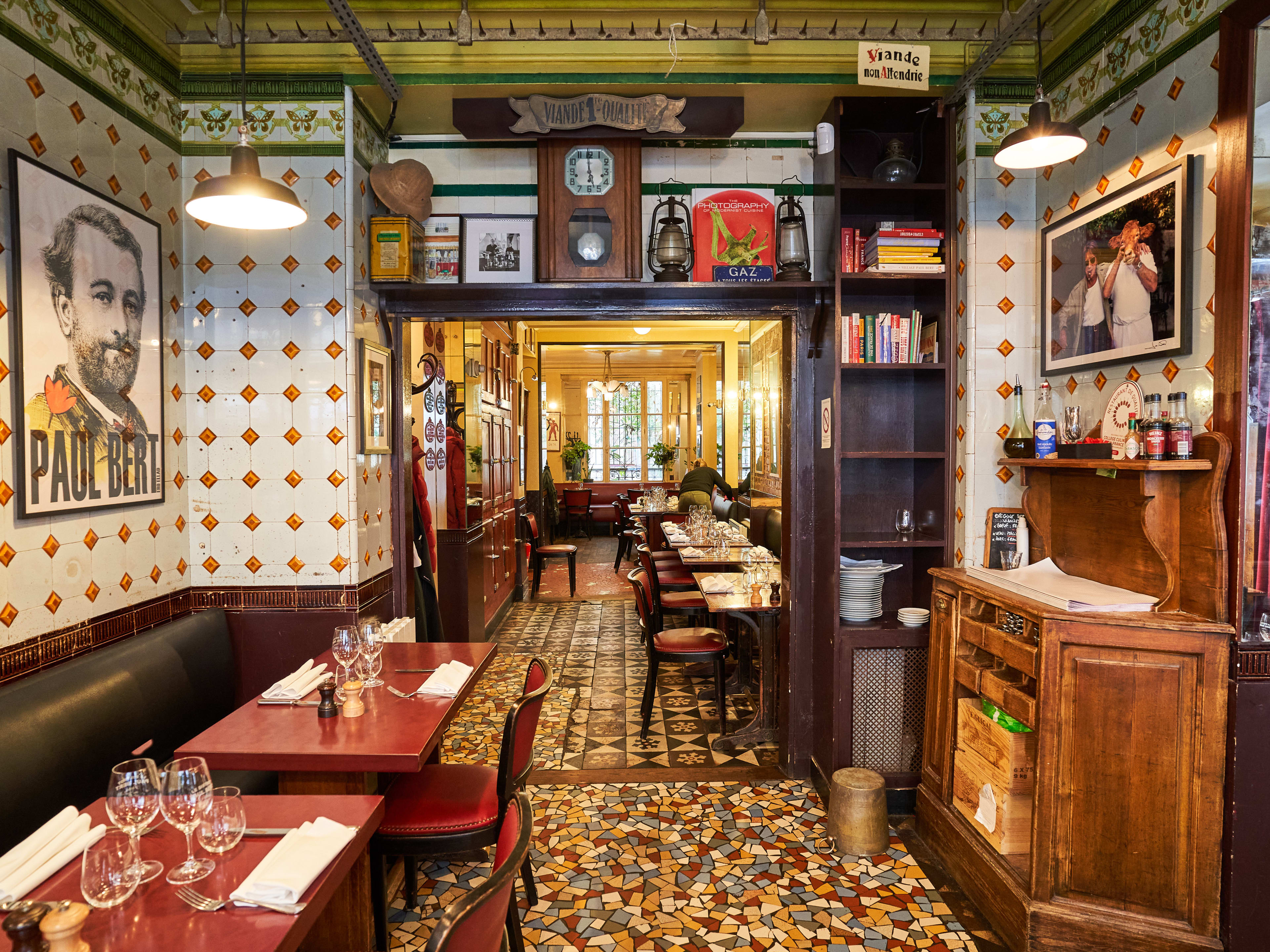 Interior dining room with colorful wallpaper at Bistrot Paul Bert