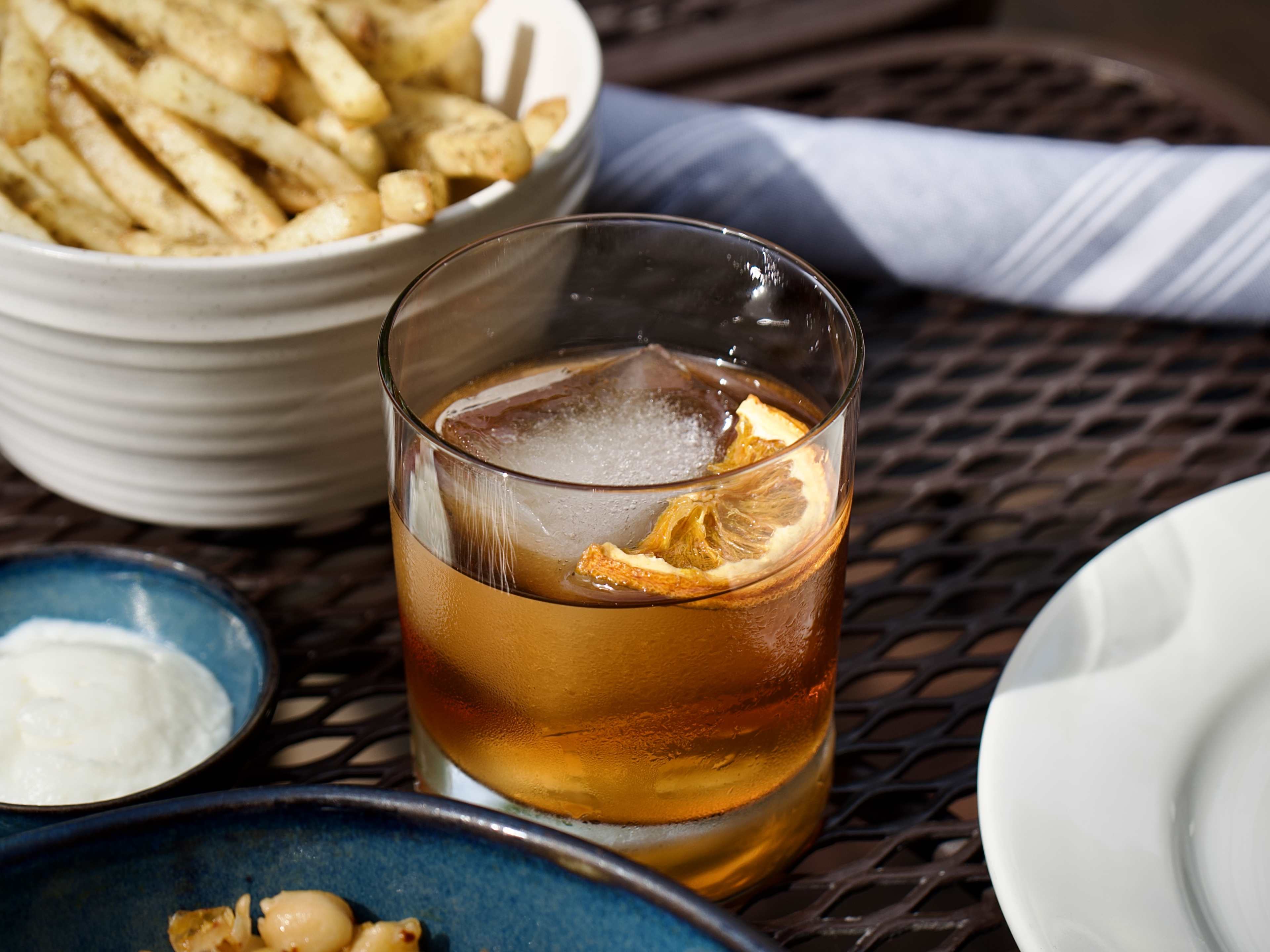 brown cocktail with fries