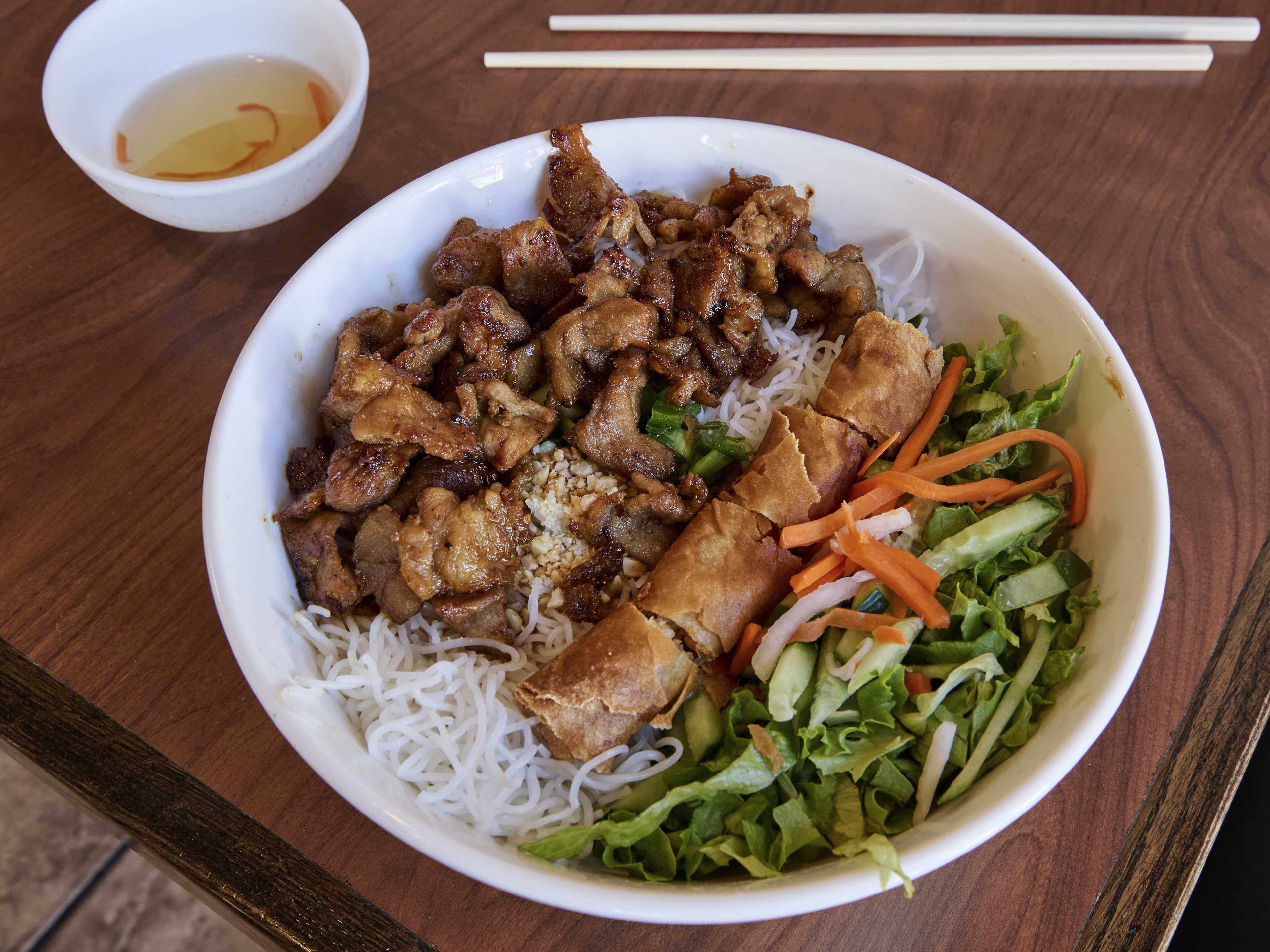 vermicelli bowl with meat, pickled veggies, and chopped up eggroll