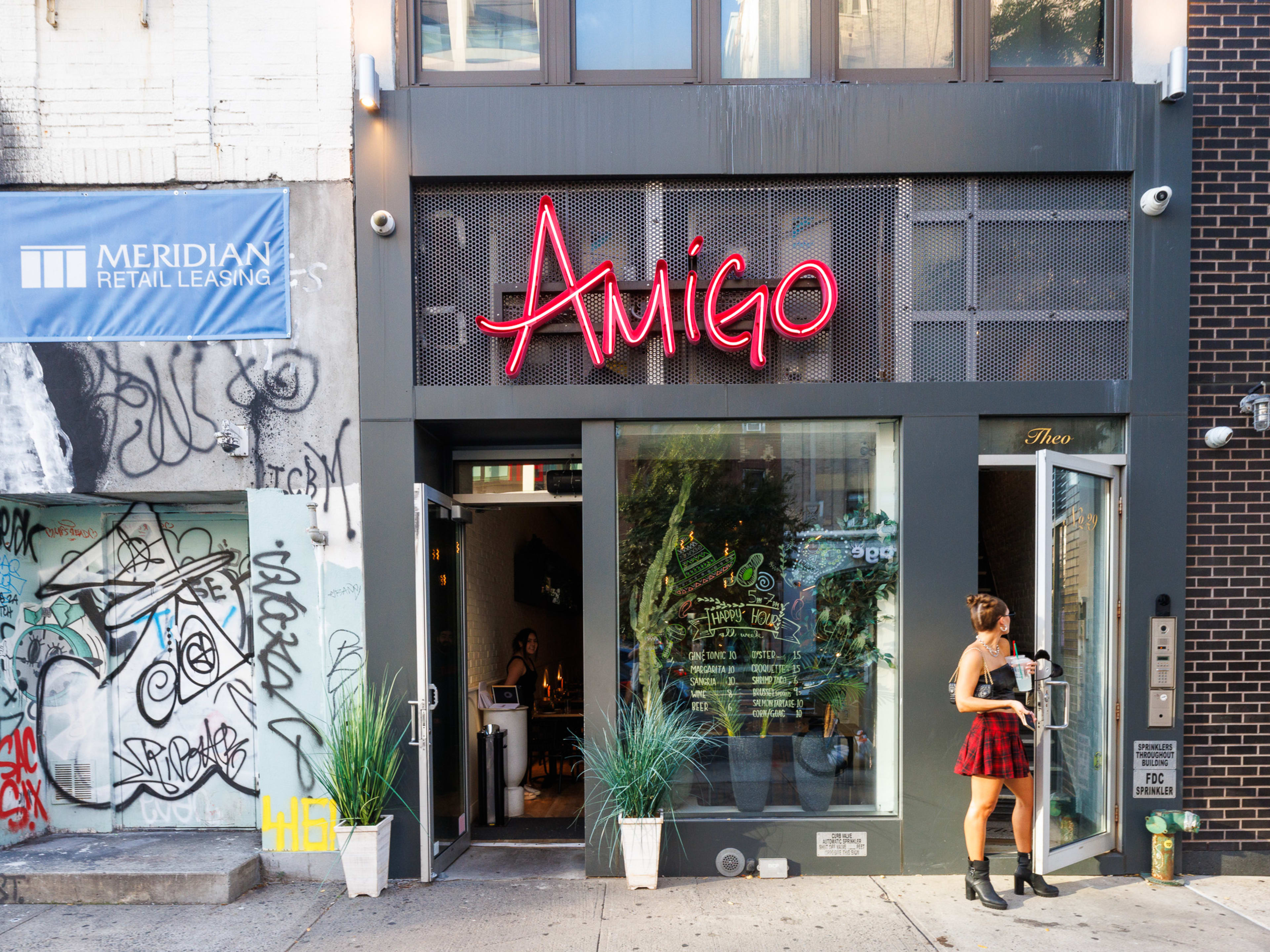 Exterior at Amigo By Nai with neon sign