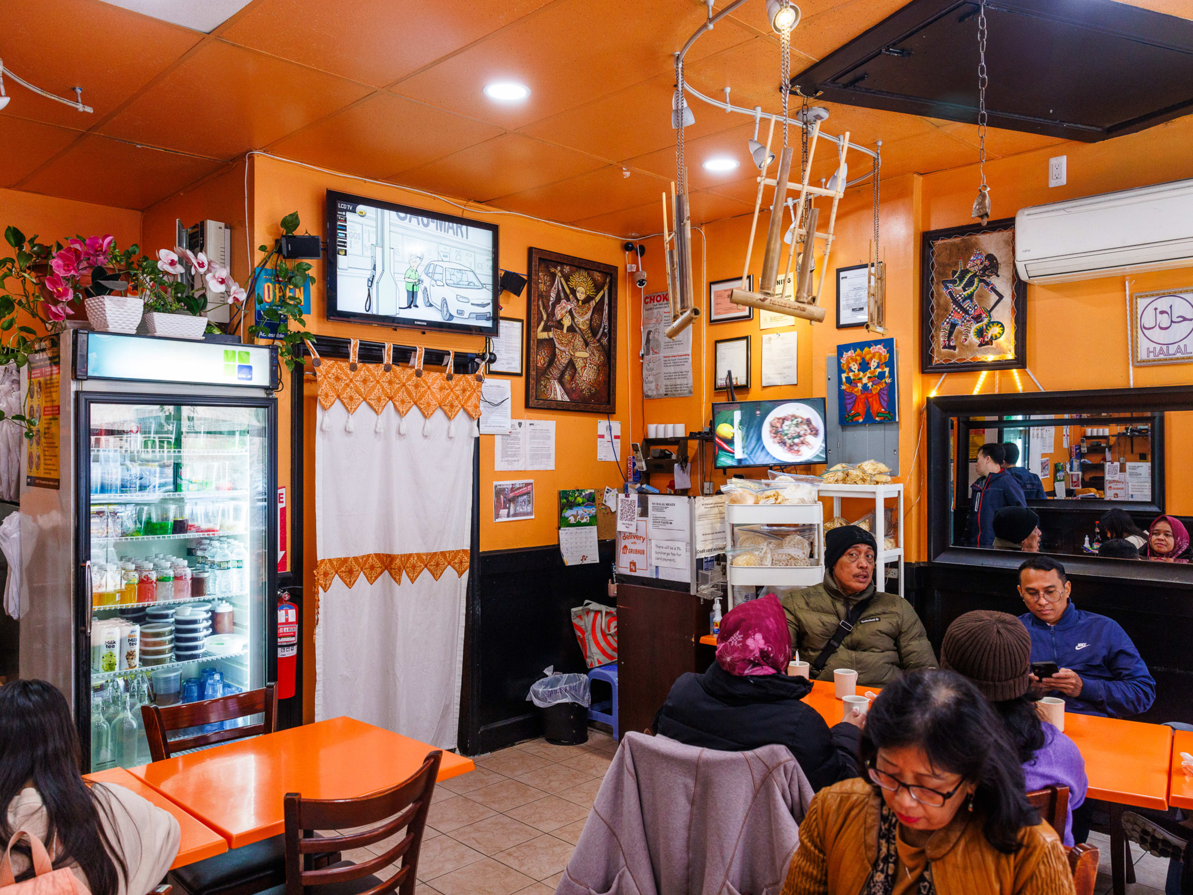 Asian Taste 86 interior with brightly colorful walls, ceiling, and tables