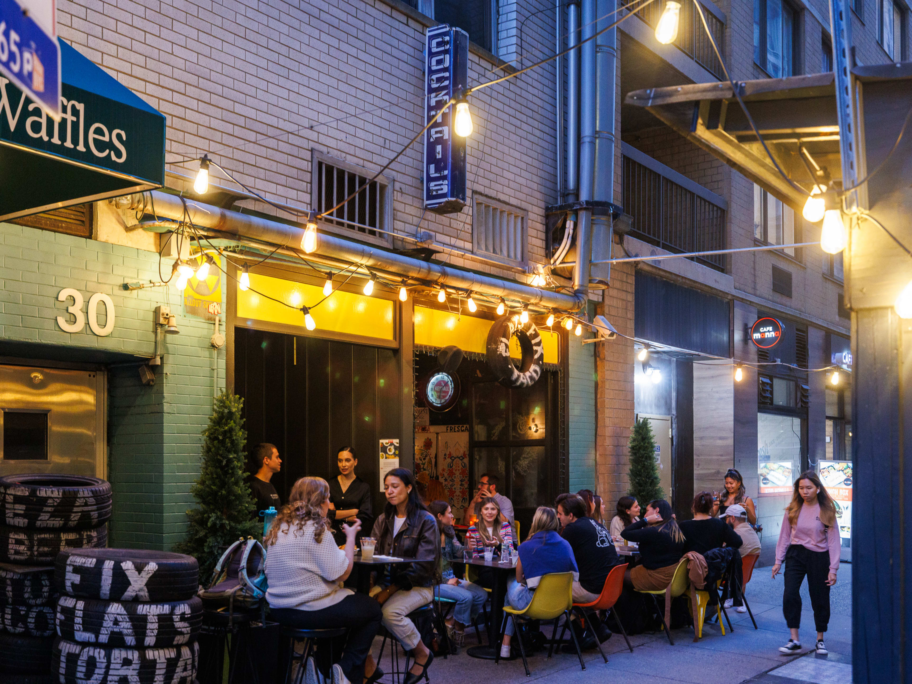 Outdoor seating at Flats Fix (aka Taco Shop)with twinkle lights