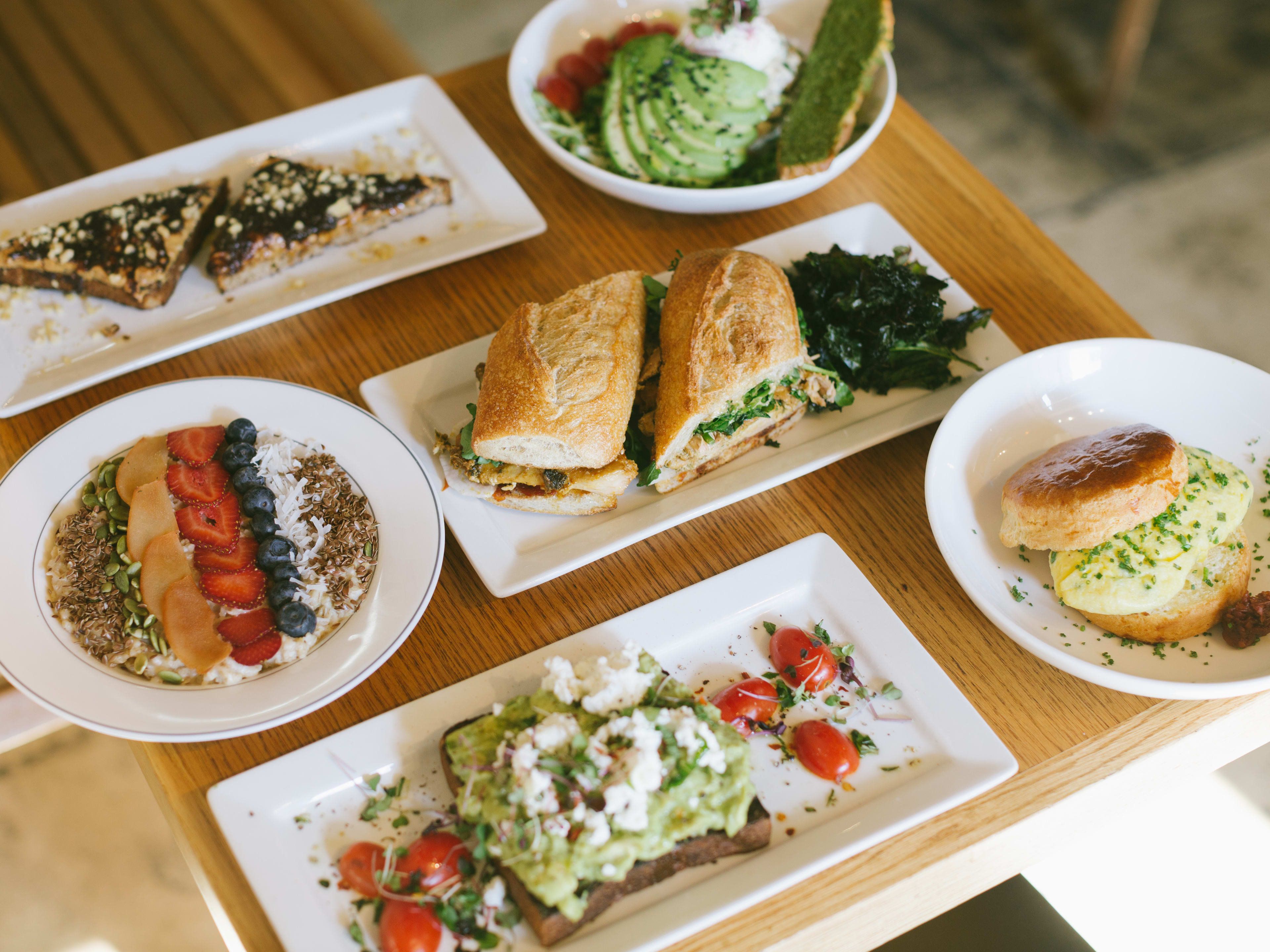 Spread of breakfast food from Gotan on a square wooden table