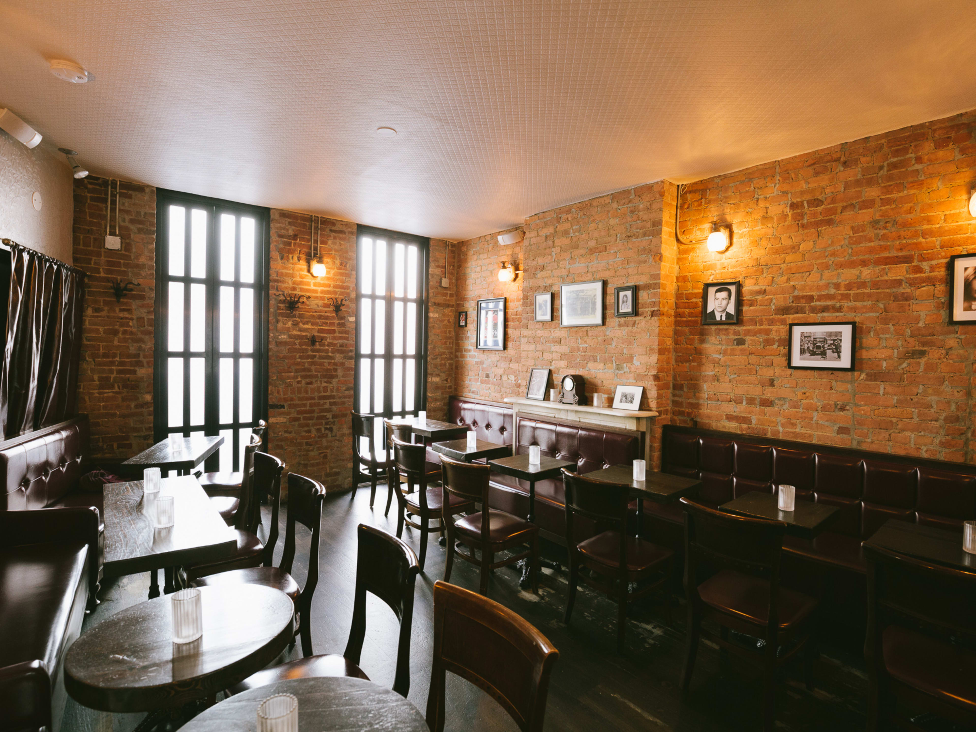 Middle Branch interior with brick walls, booth seating and tall windows