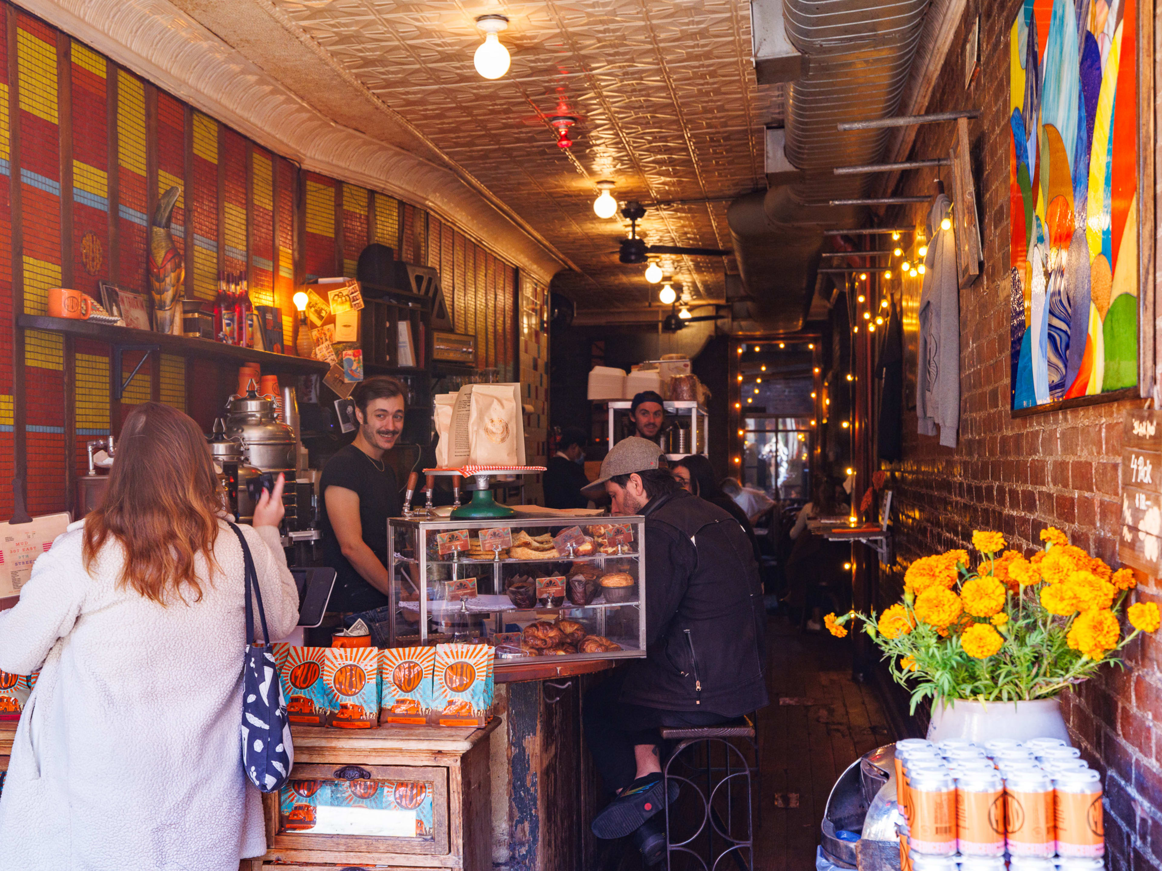 Mudspot interior with checkout counter and brick walls