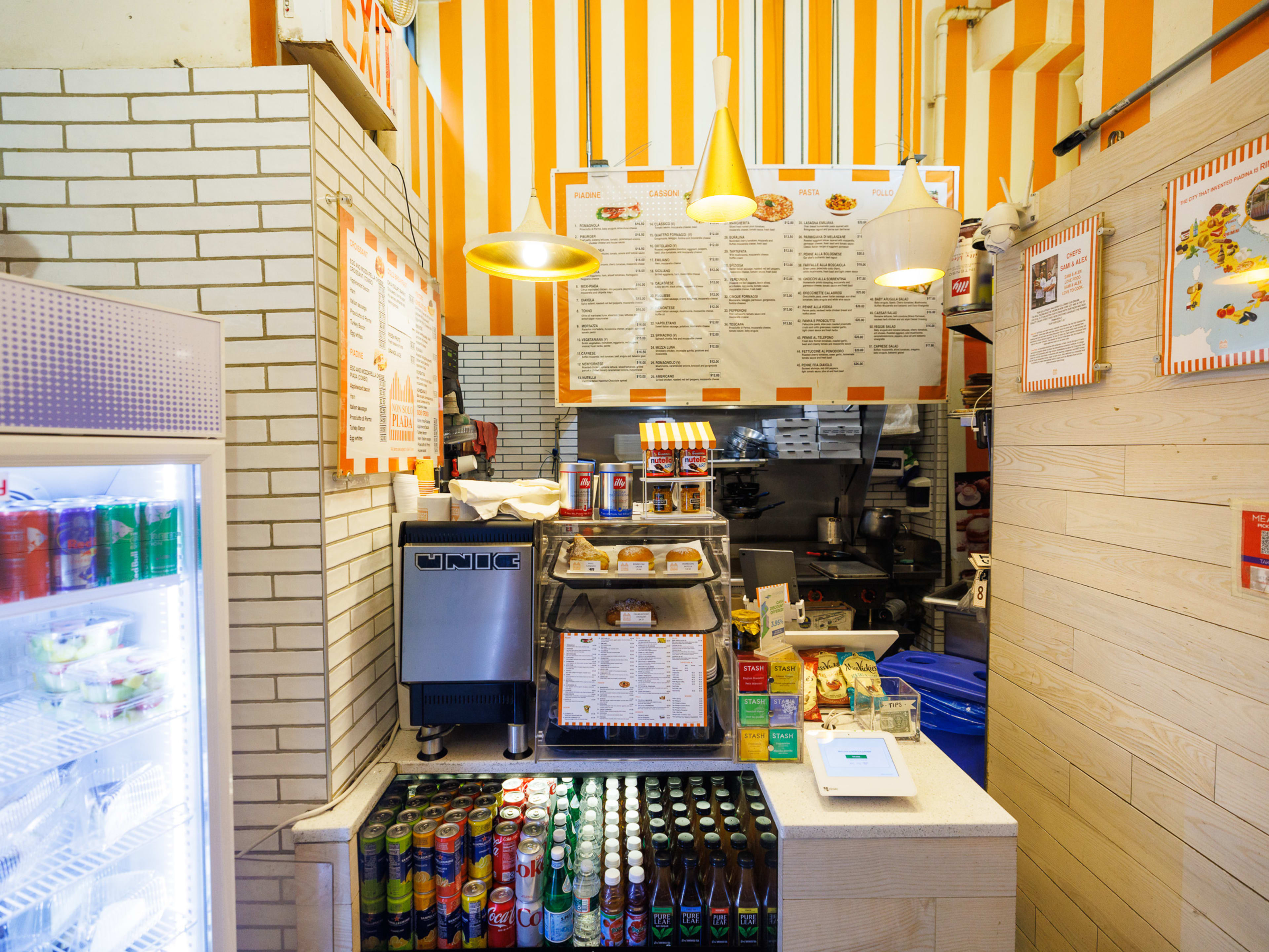 Non Solo Piada interior with checkout counter and striped walls