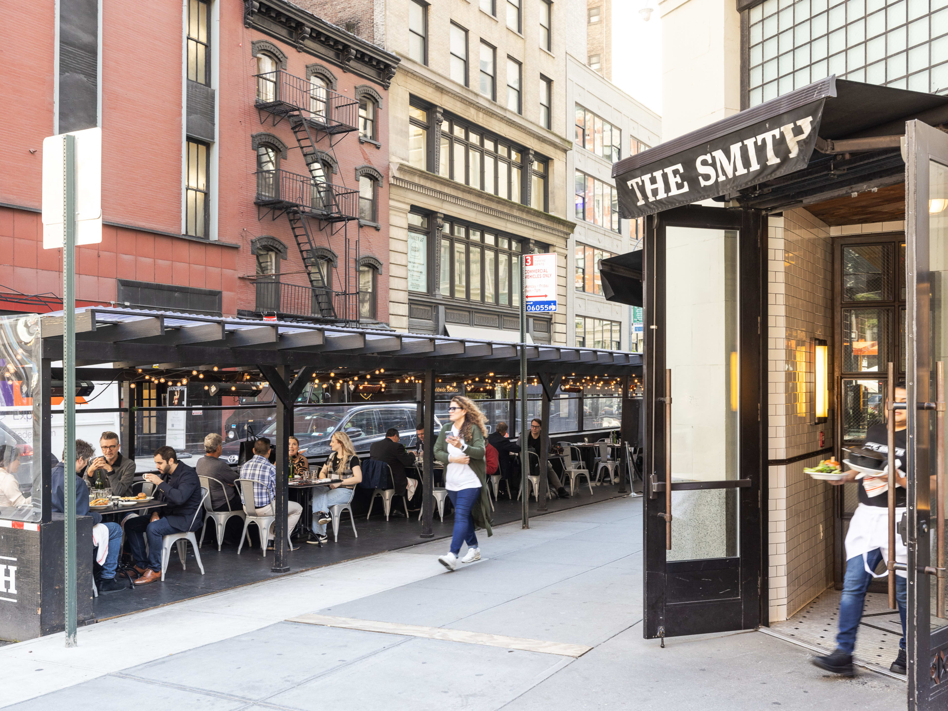 Exterior at The Smith with outdoor seating in the street