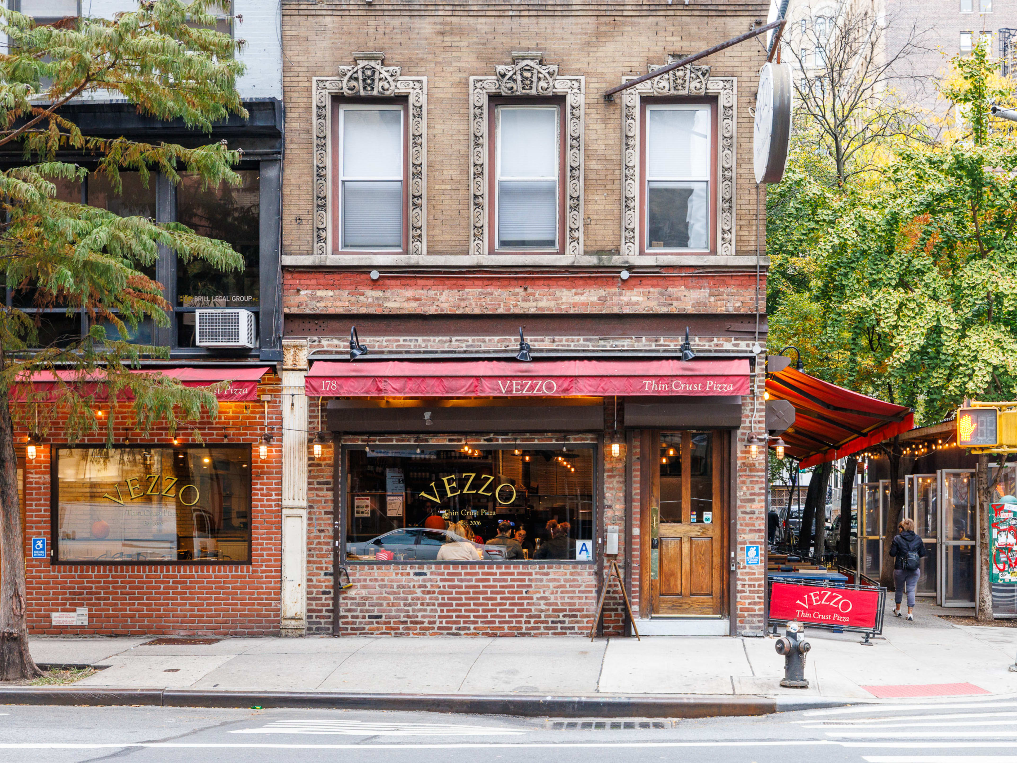 Vezzo Thin Crust Pizza brick exterior on a corner