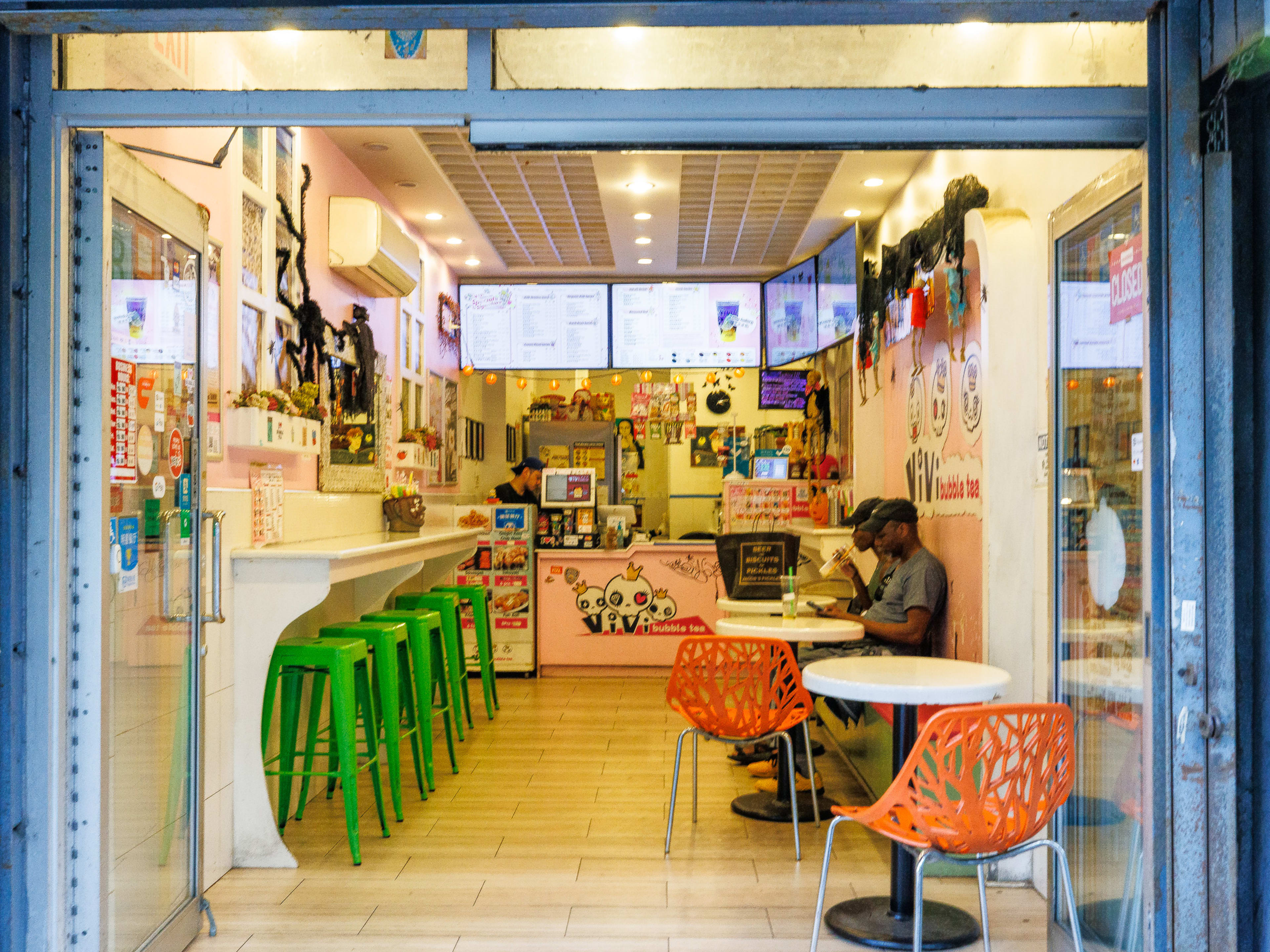 Vivi Bubble Tea interior with colorful stools and wall murals