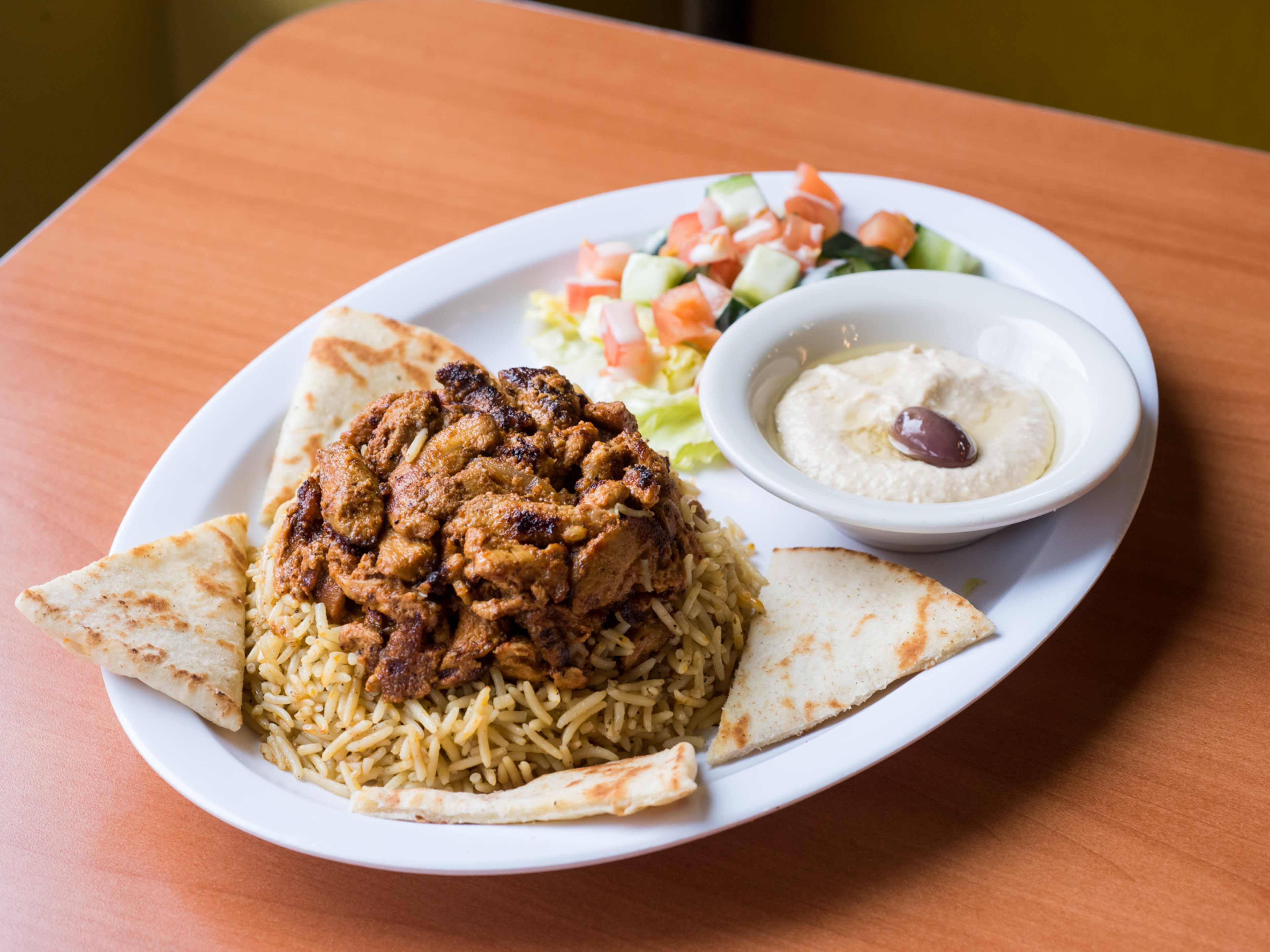 chicken shawarma plate with rice and pita