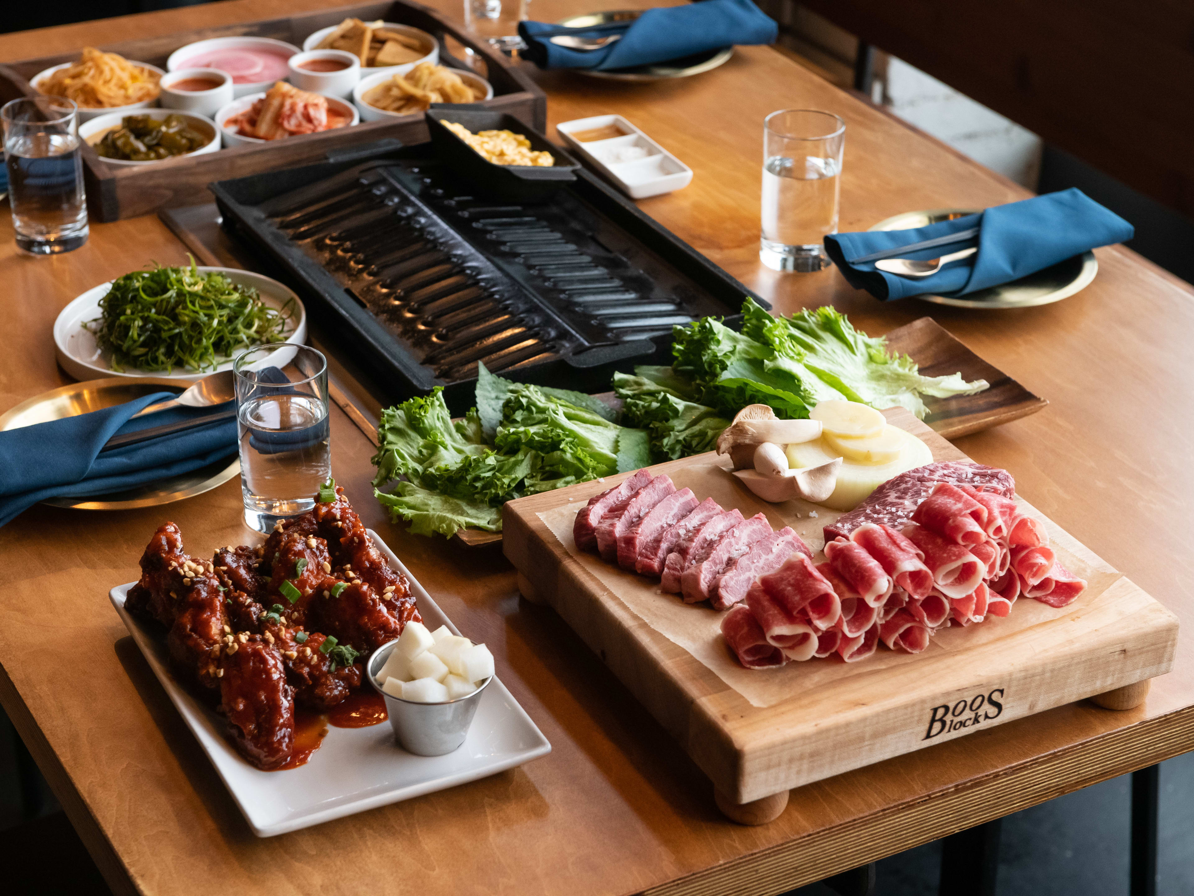 table spread of Korean BBQ meats