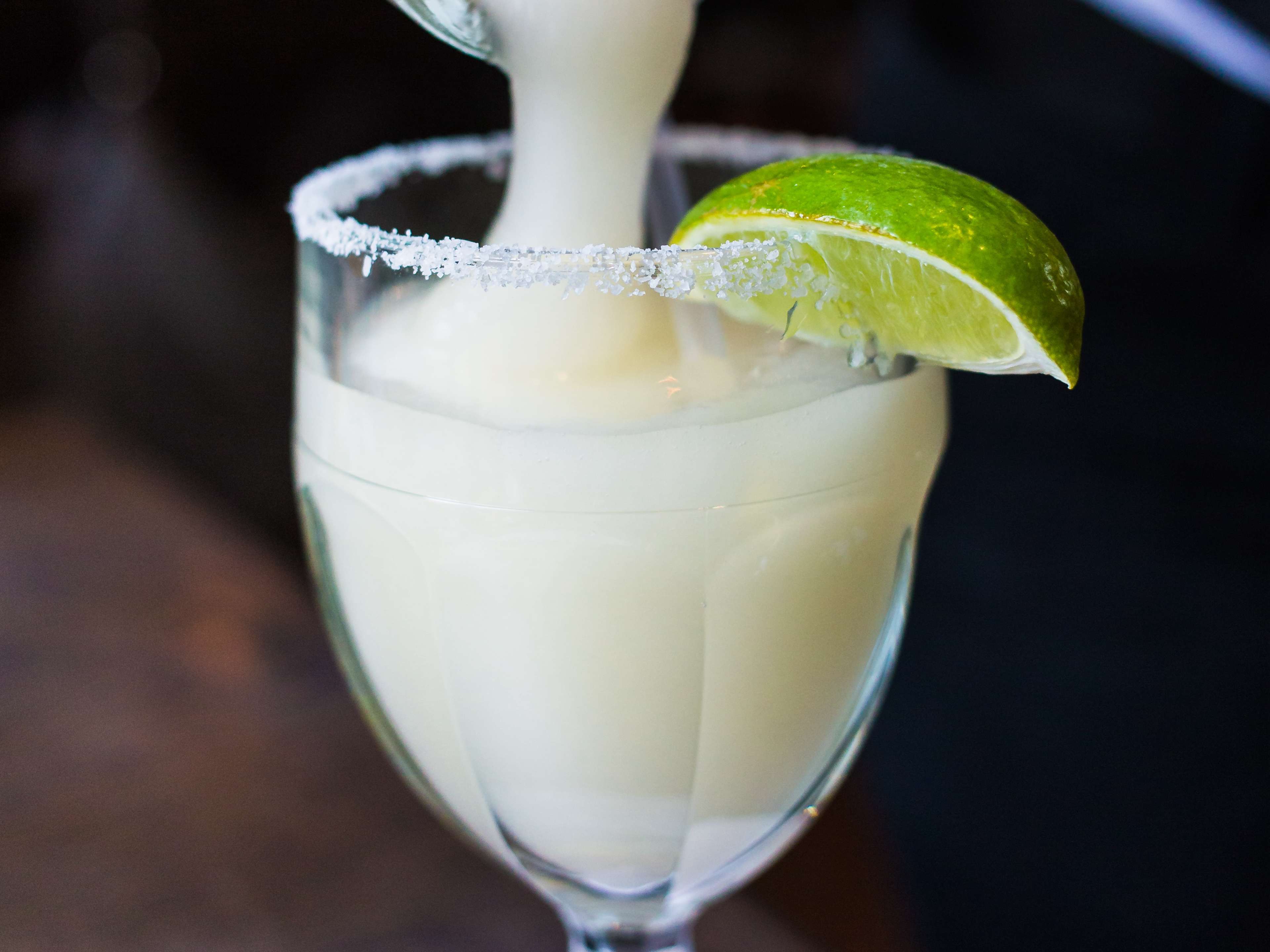 frozen margarita at The Original Ninfa's On Navigation with a salted rim and a wedge of lime