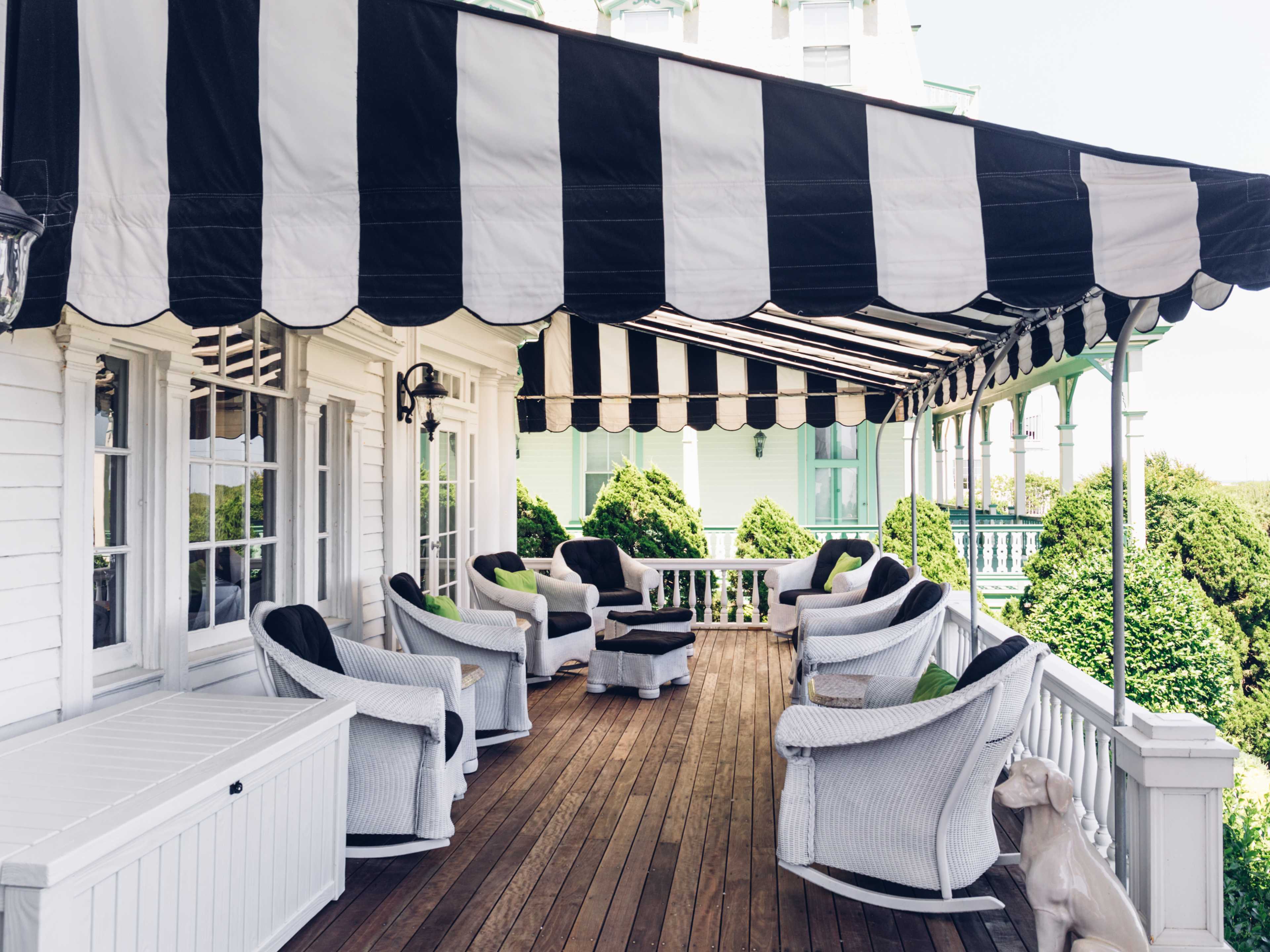 patio seating with awning and comfy chairs