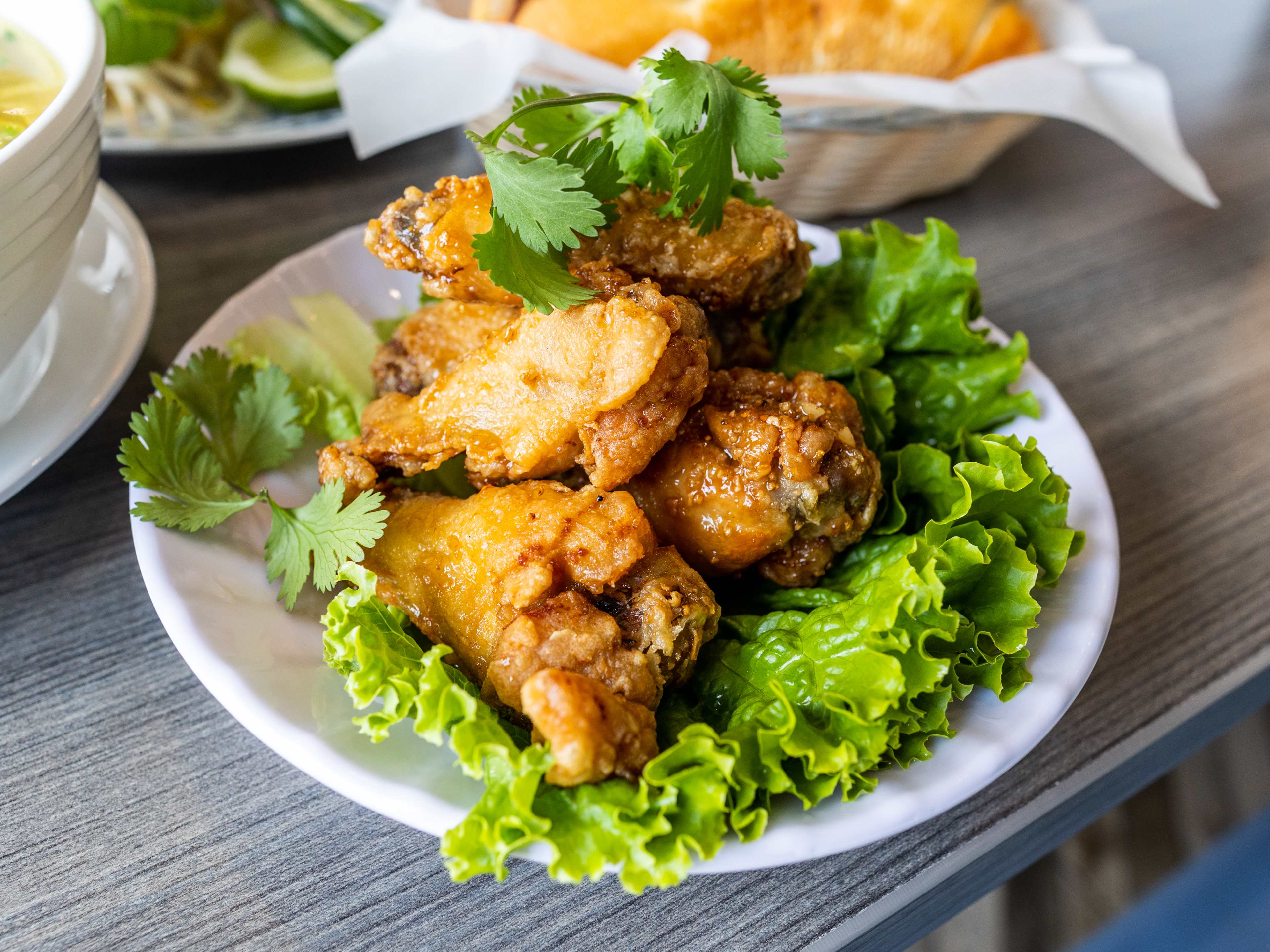 The crispy chicken wings with fish sauce over a bed of lettuce from Pho Phong Lu'u.