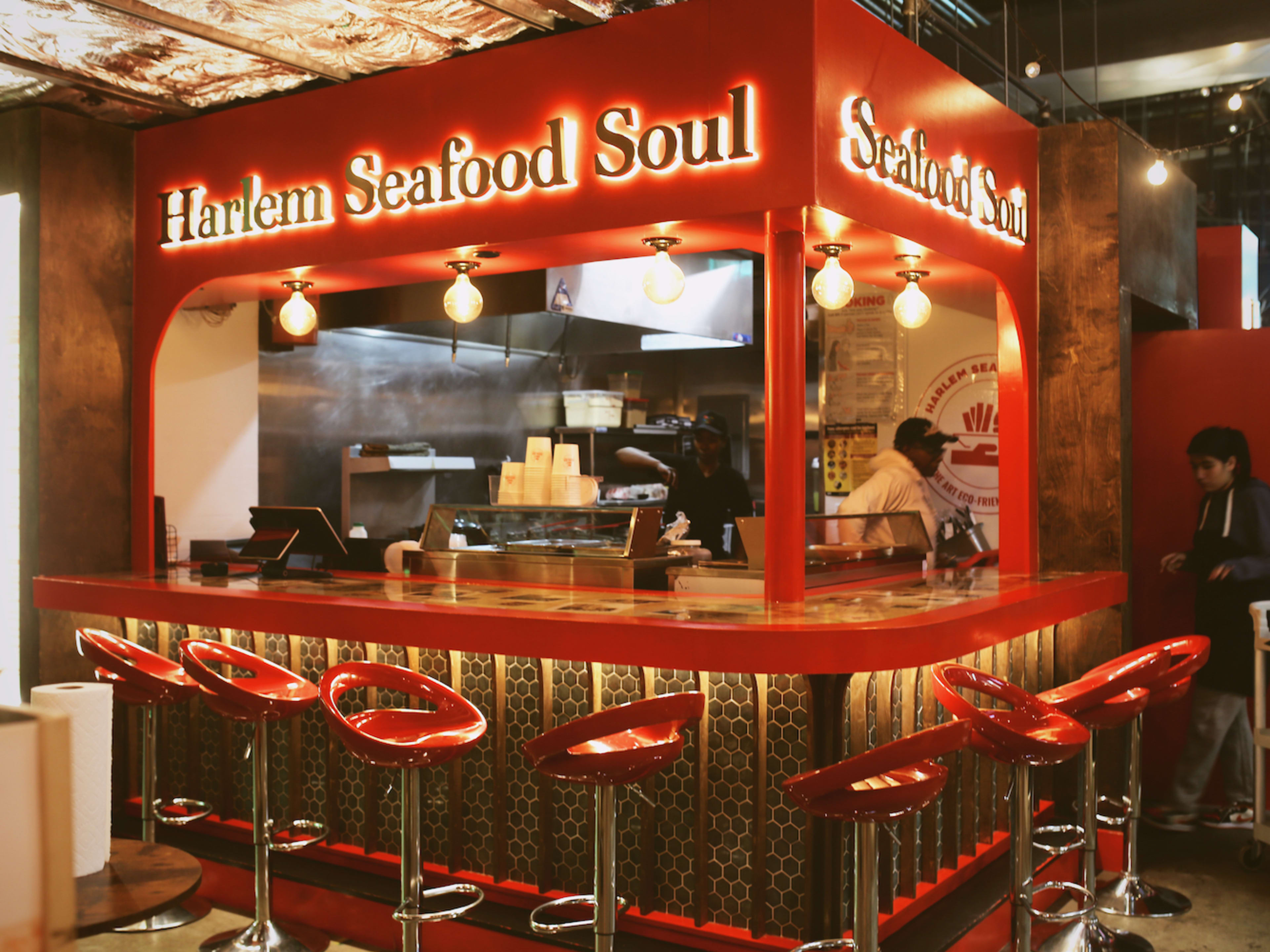 the facade of Harlem Seafood Soul in Dekalb Market hall