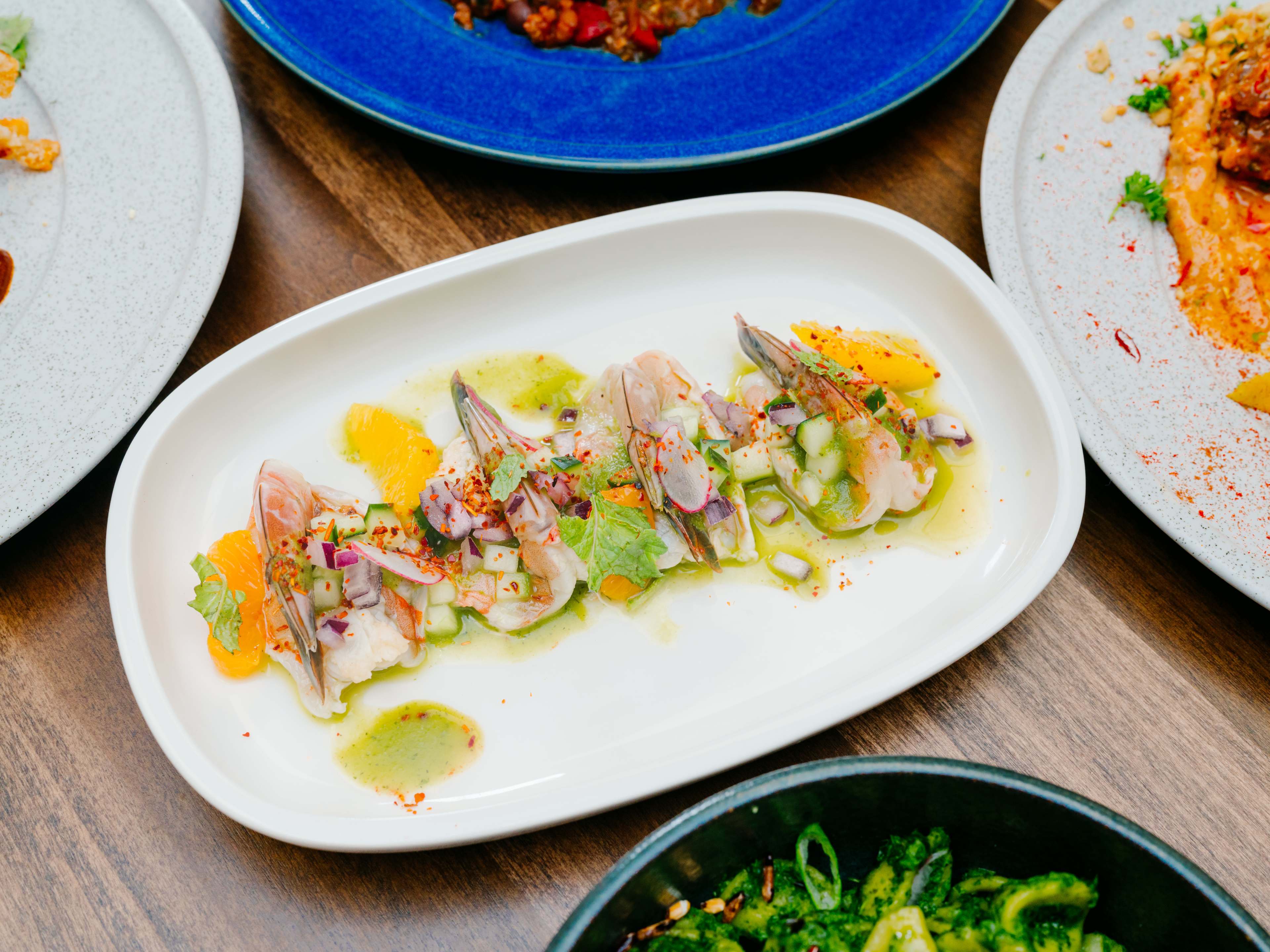 plate of pickled shrimp at Late August with cucumber and orange supremes