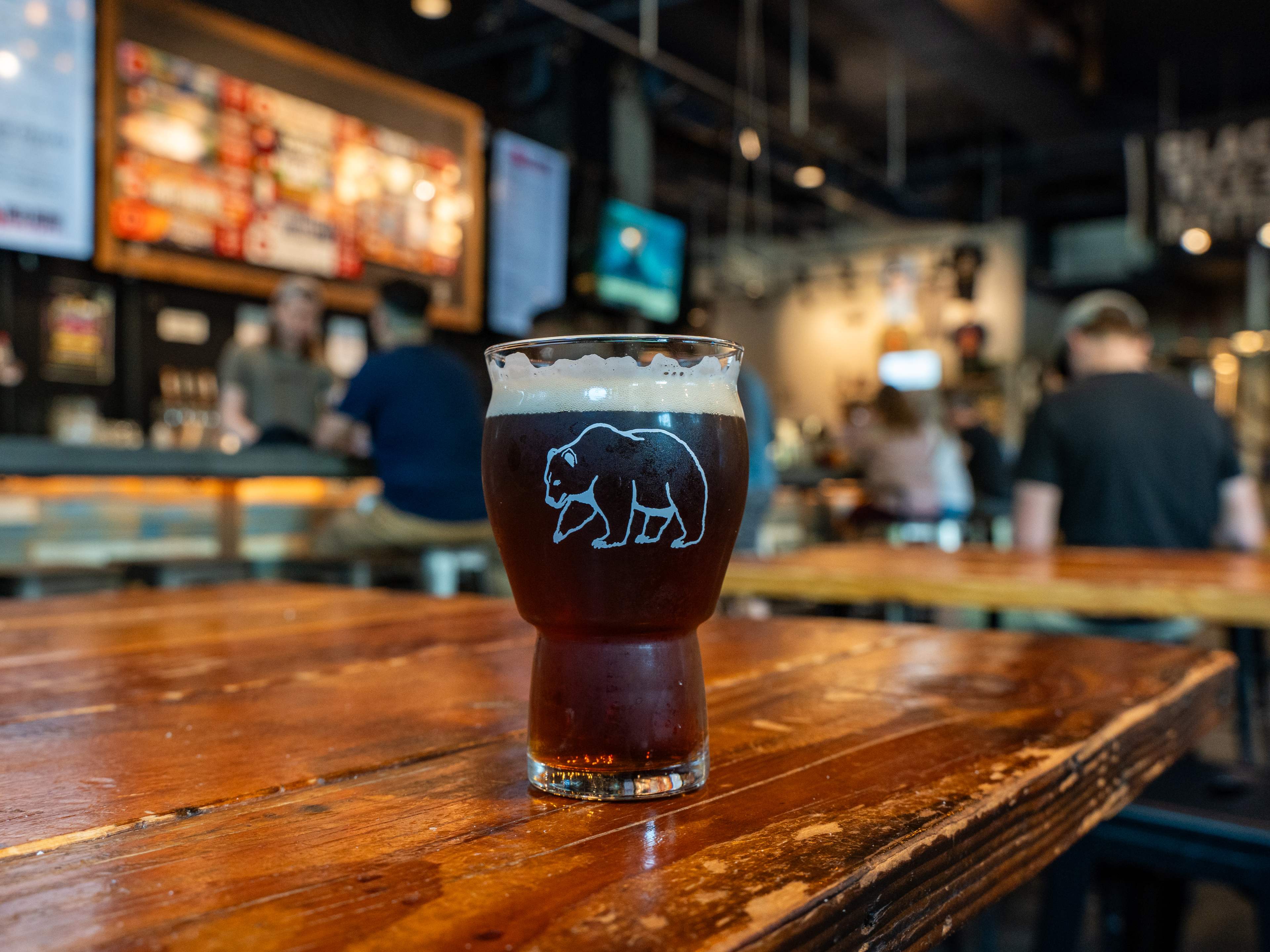 glass of beer on wooden table