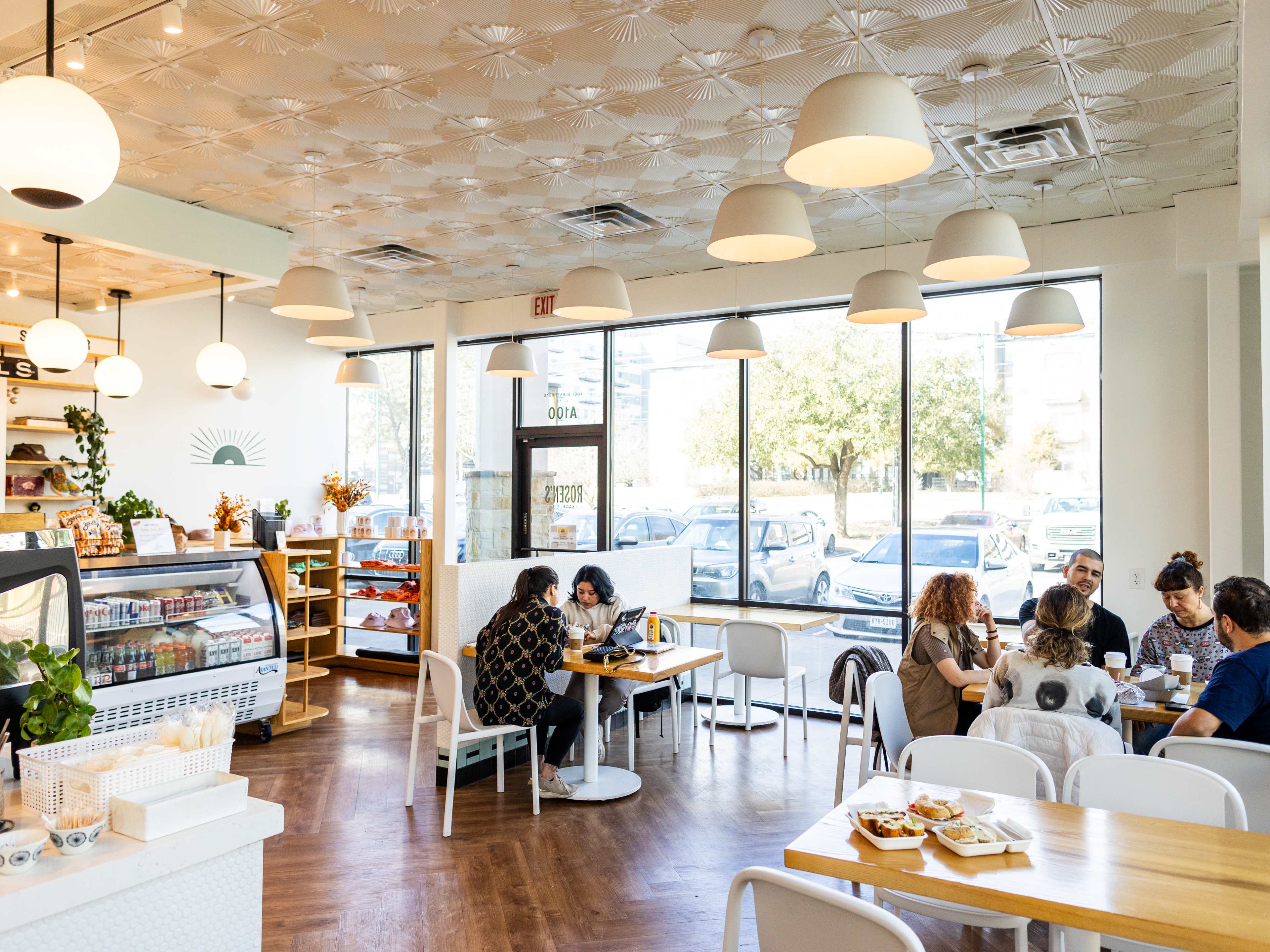 People dining at tables at Rosen's Bagels.