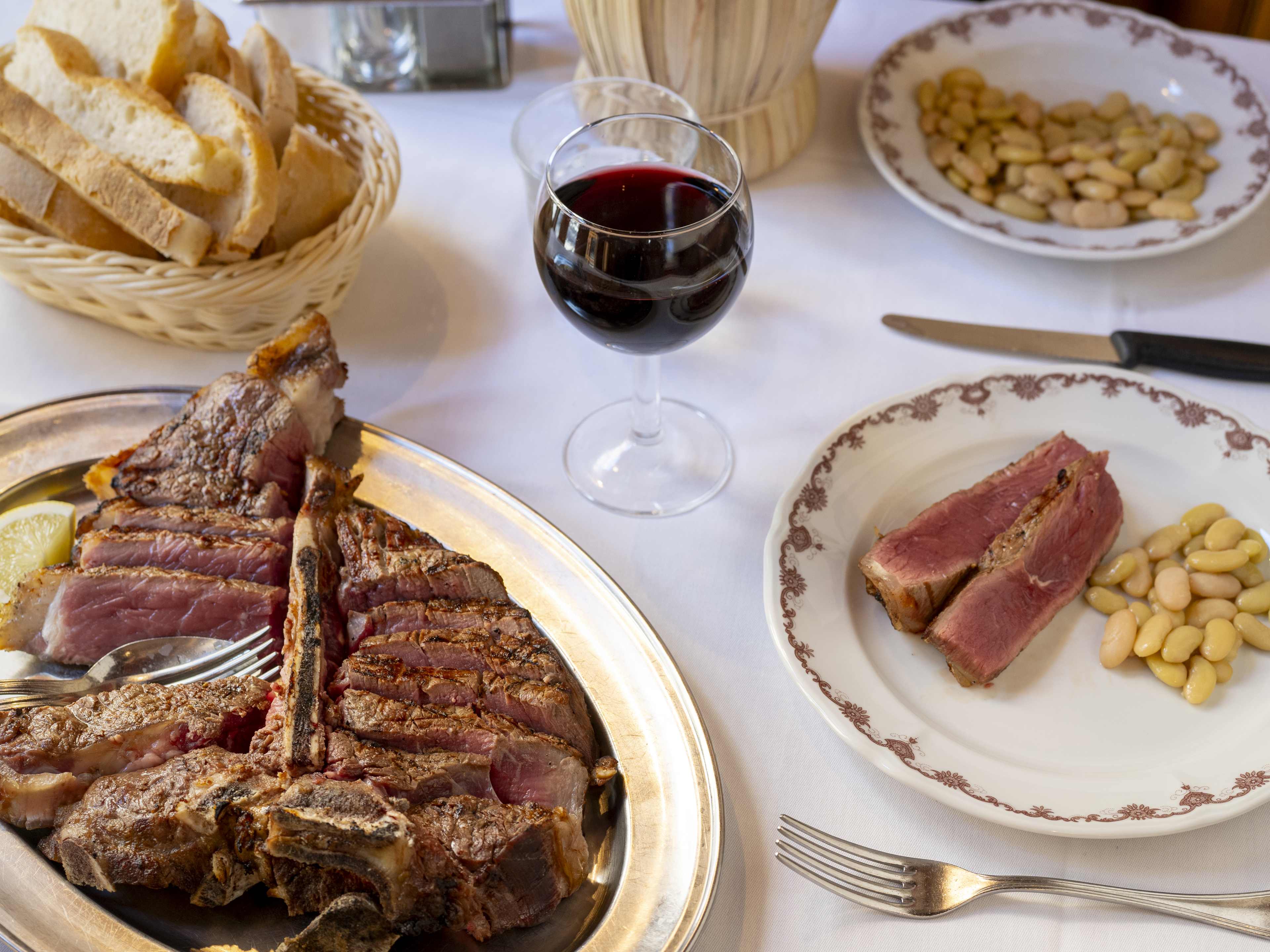 Spread of steak and sides at Trattoria Ruggero