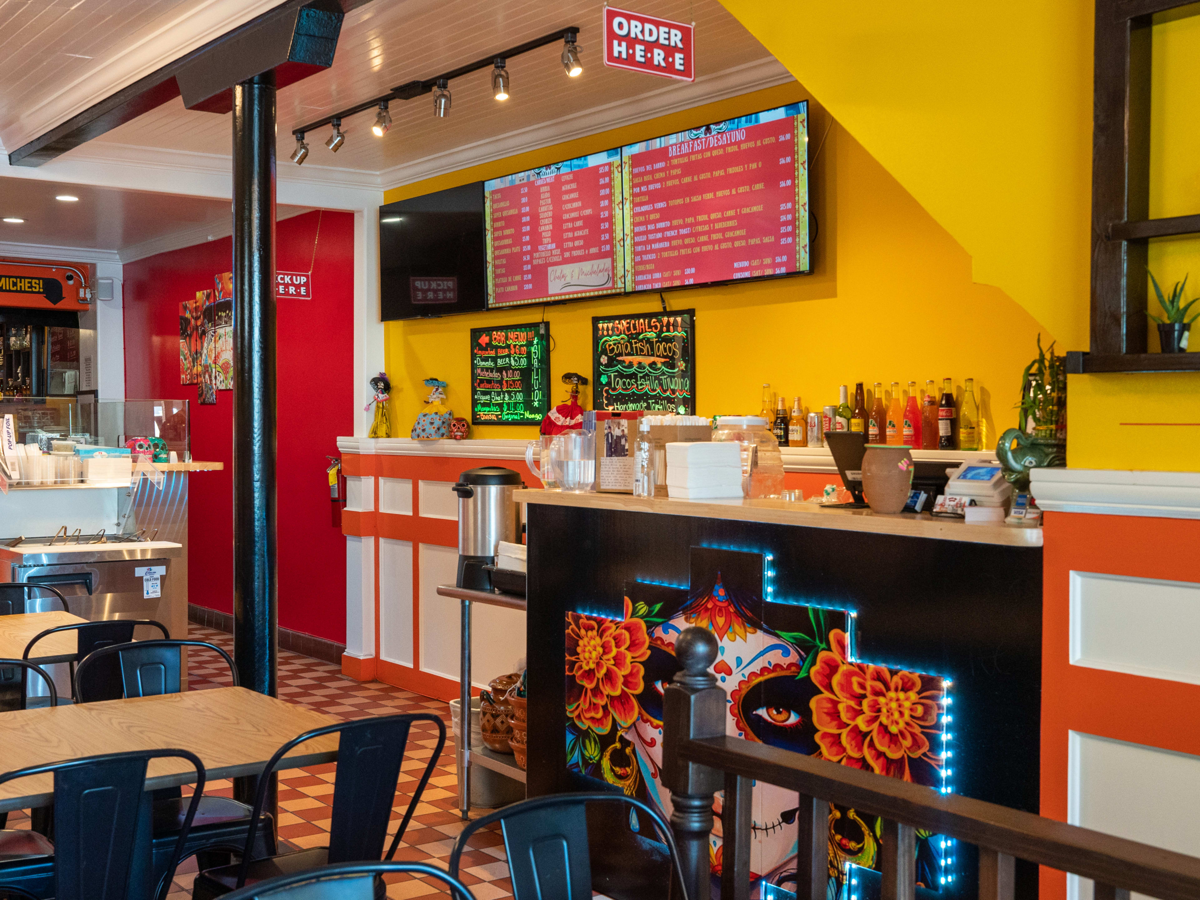 The interior and salsa bar at Tacos Del Barrio