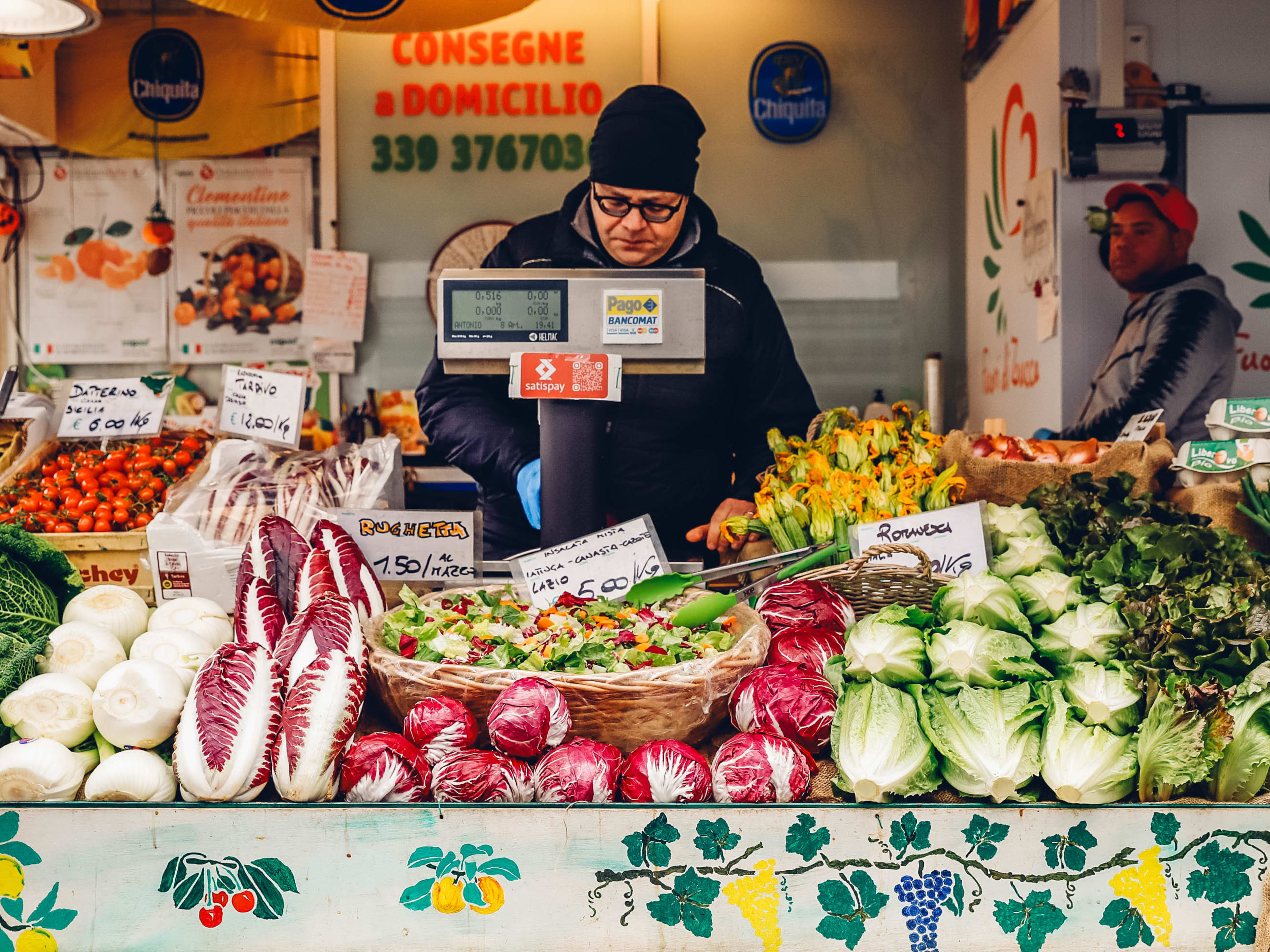 The owner of a produce vendor at Testaccio Market.