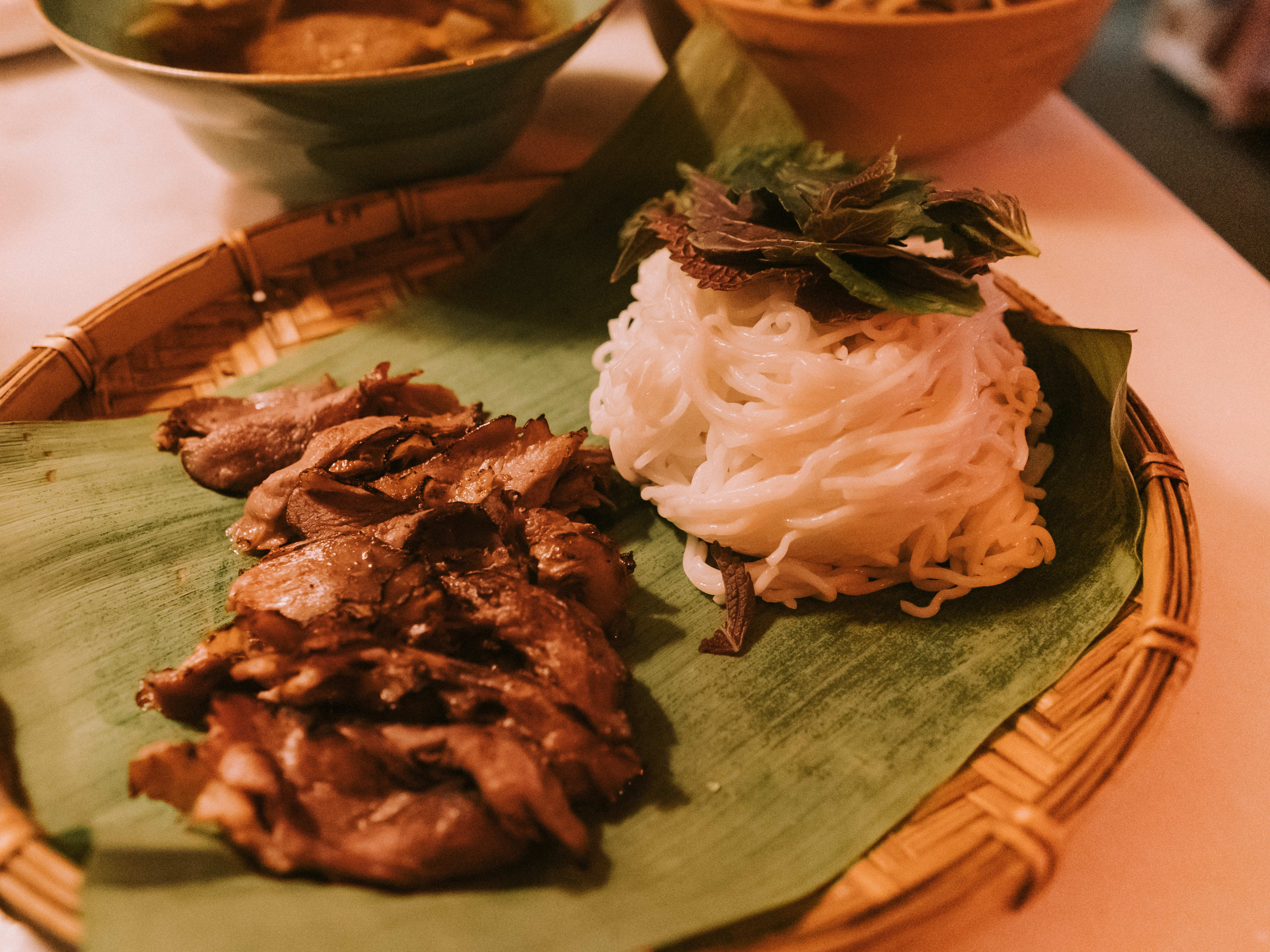 Bun Cha grilled duck breast plated on a banana leaf at The Eaves