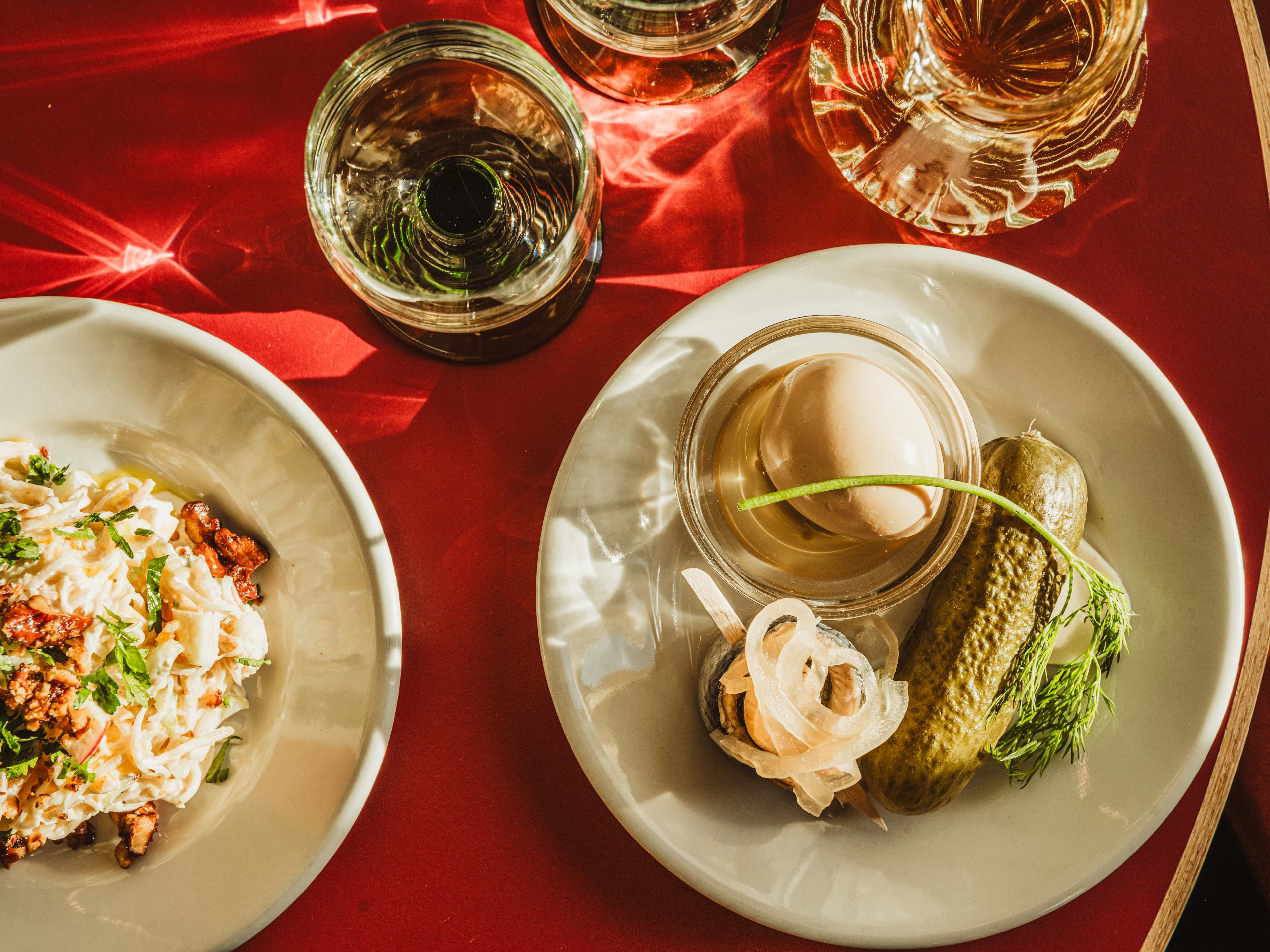 Pickle trio on red table at Trio