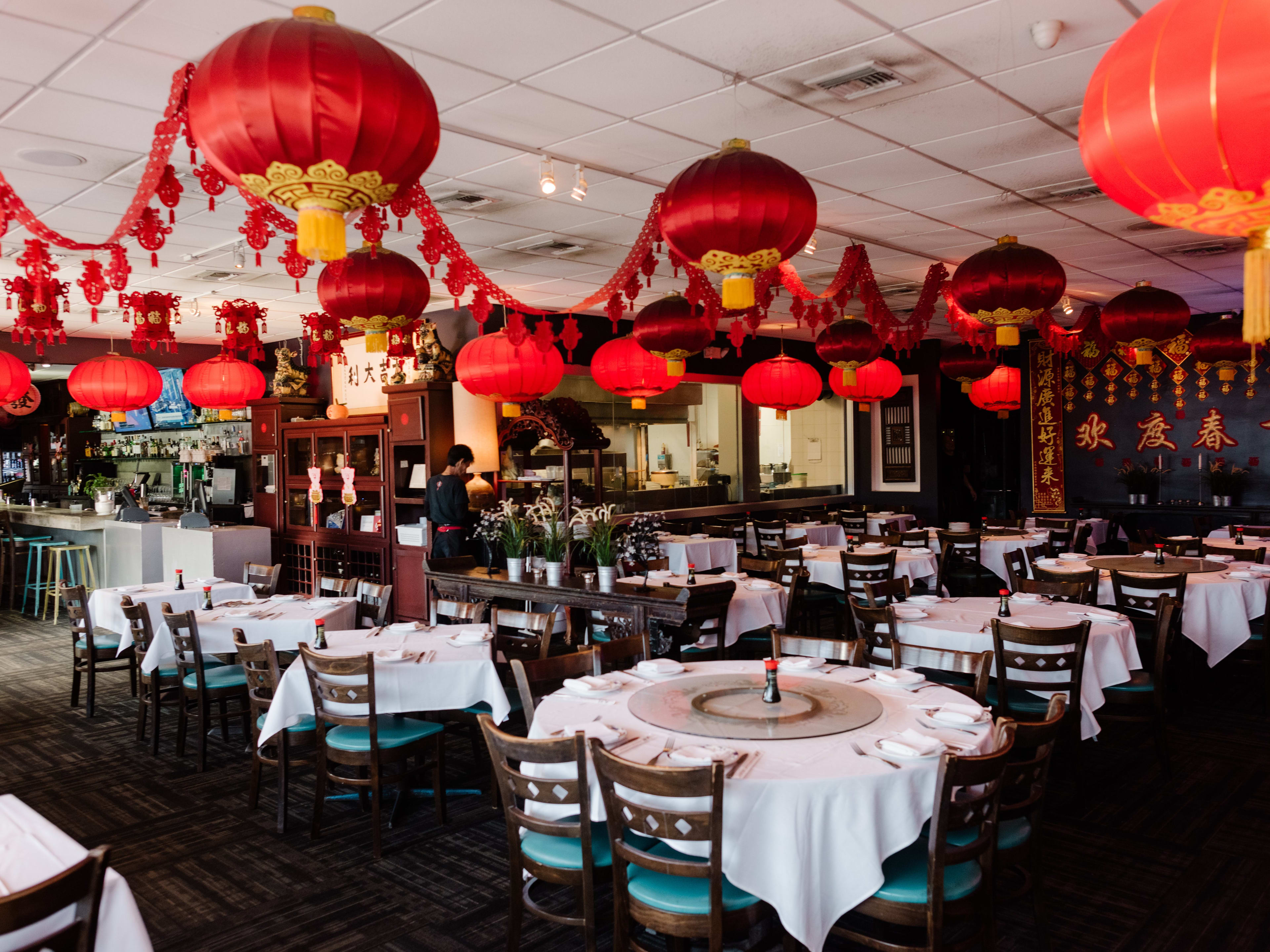 interior of dim sum restaurant with red lanterns and decorations hanging from ceiling