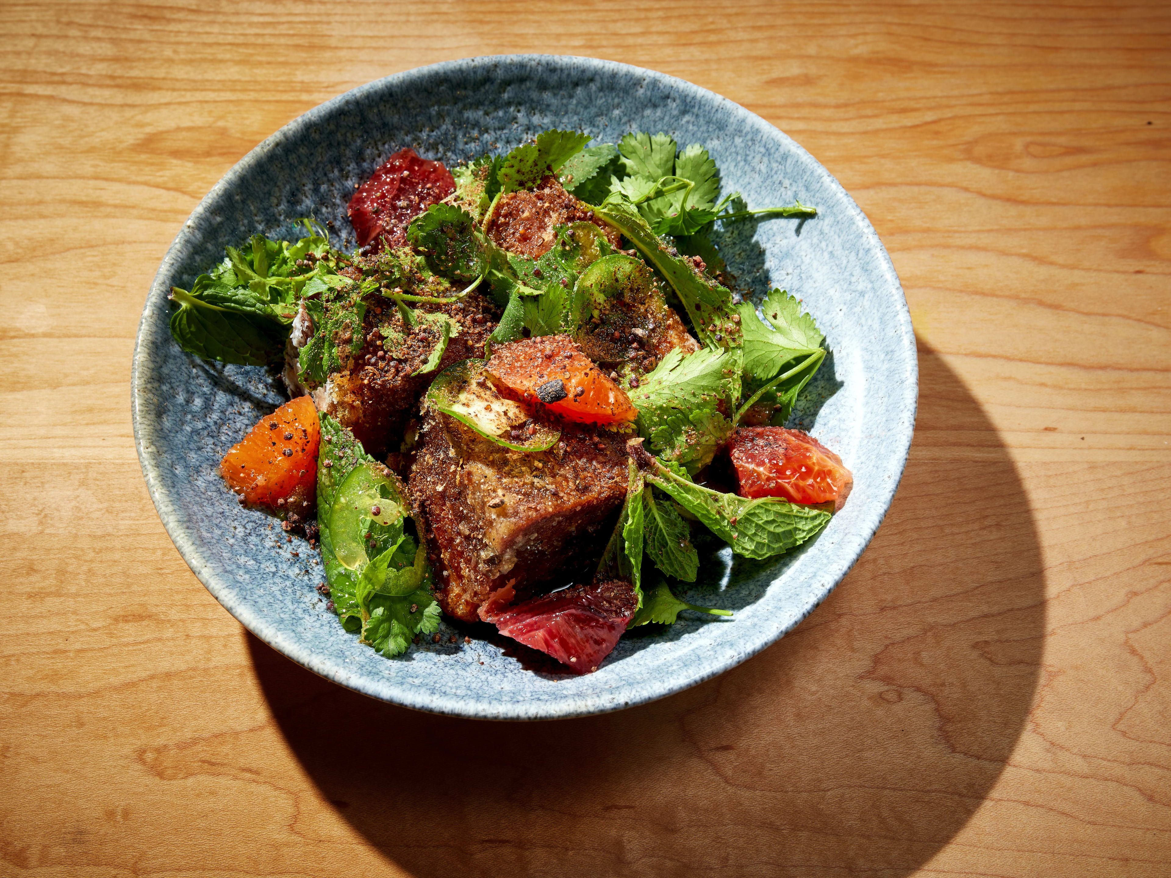 The pork belly salad at State Bird Provisions