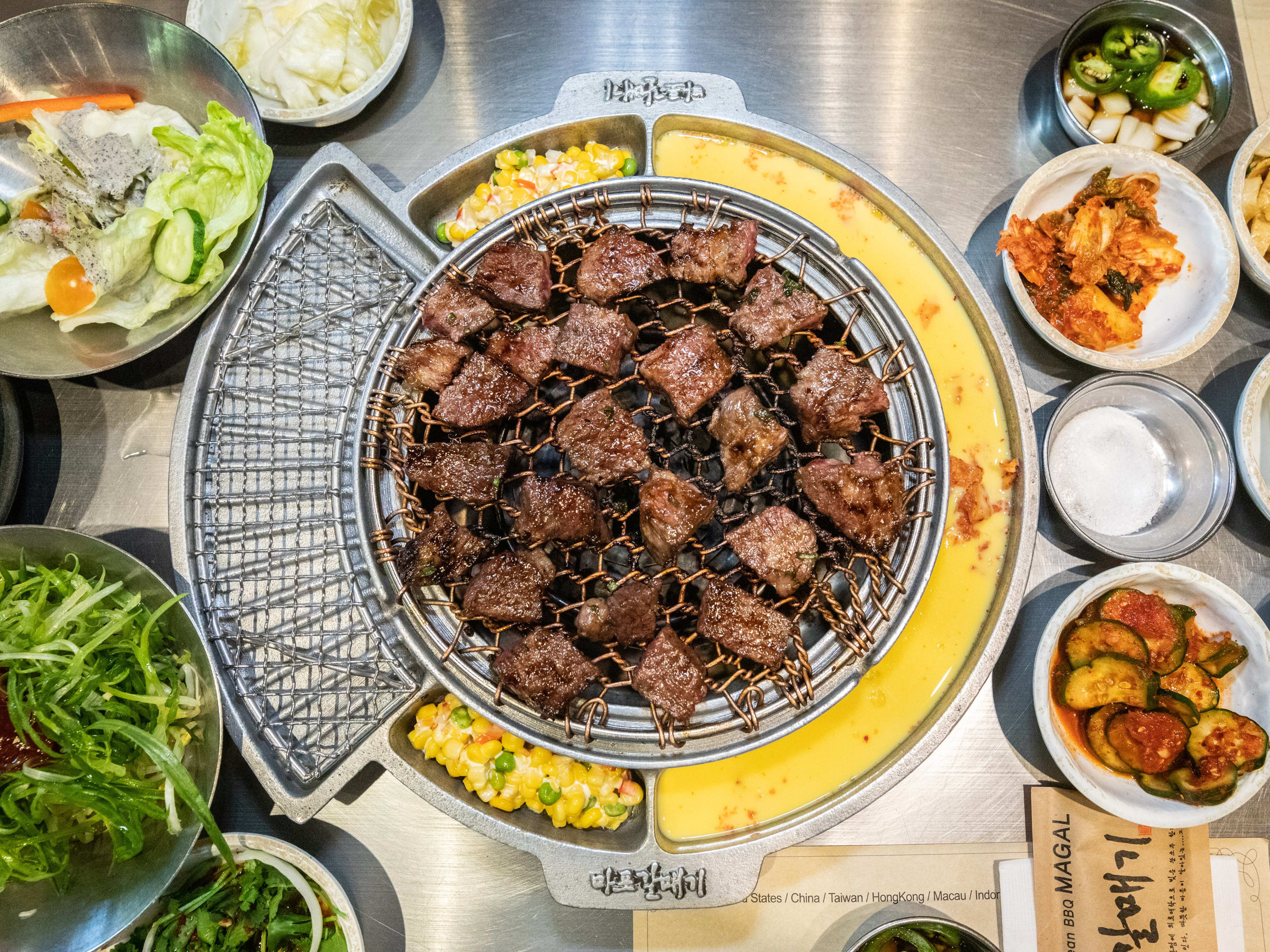 Meat on the tabletop grill at Magal BBQ.