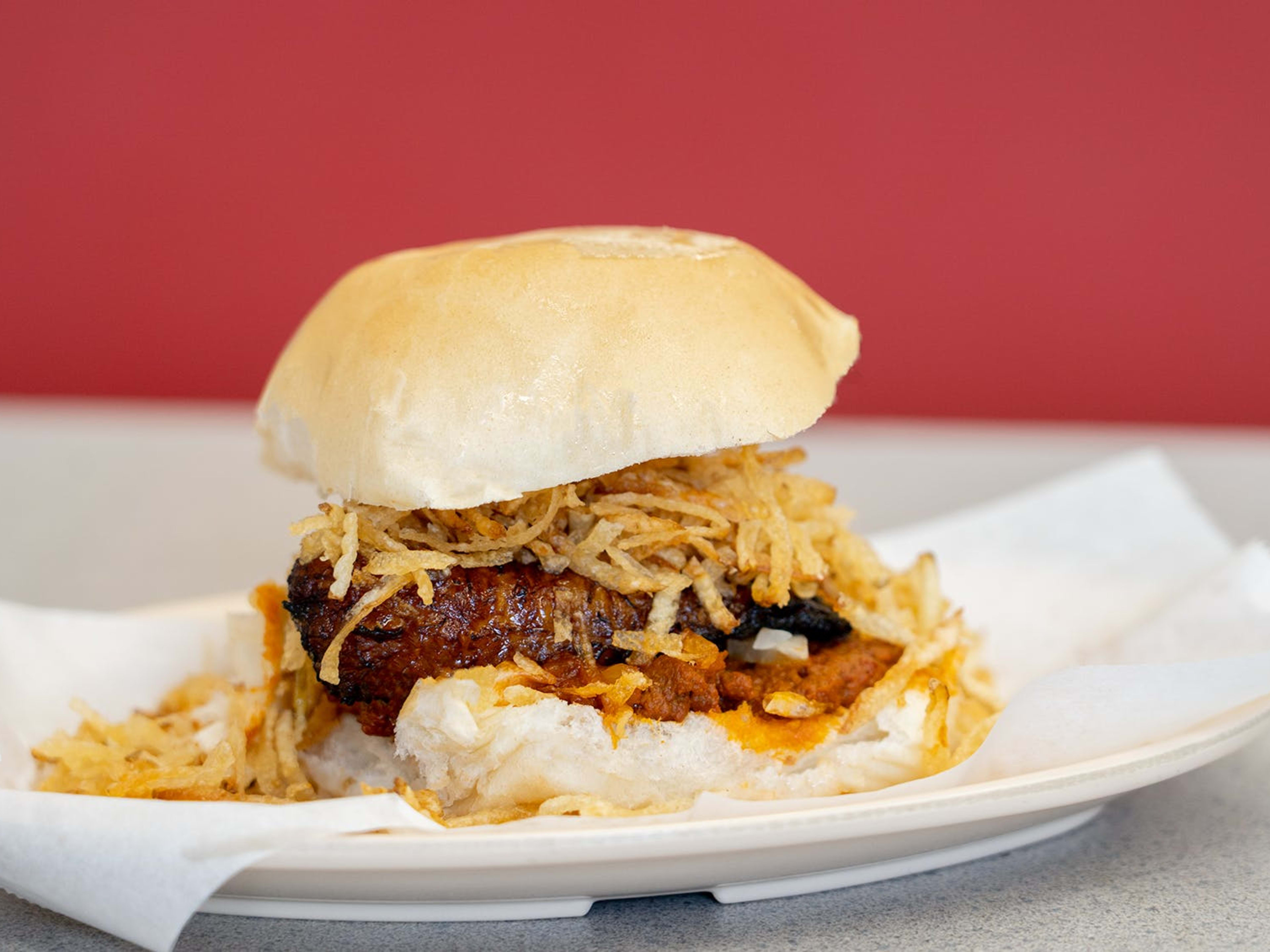 frita sandwich with meat potato sticks bread and spread