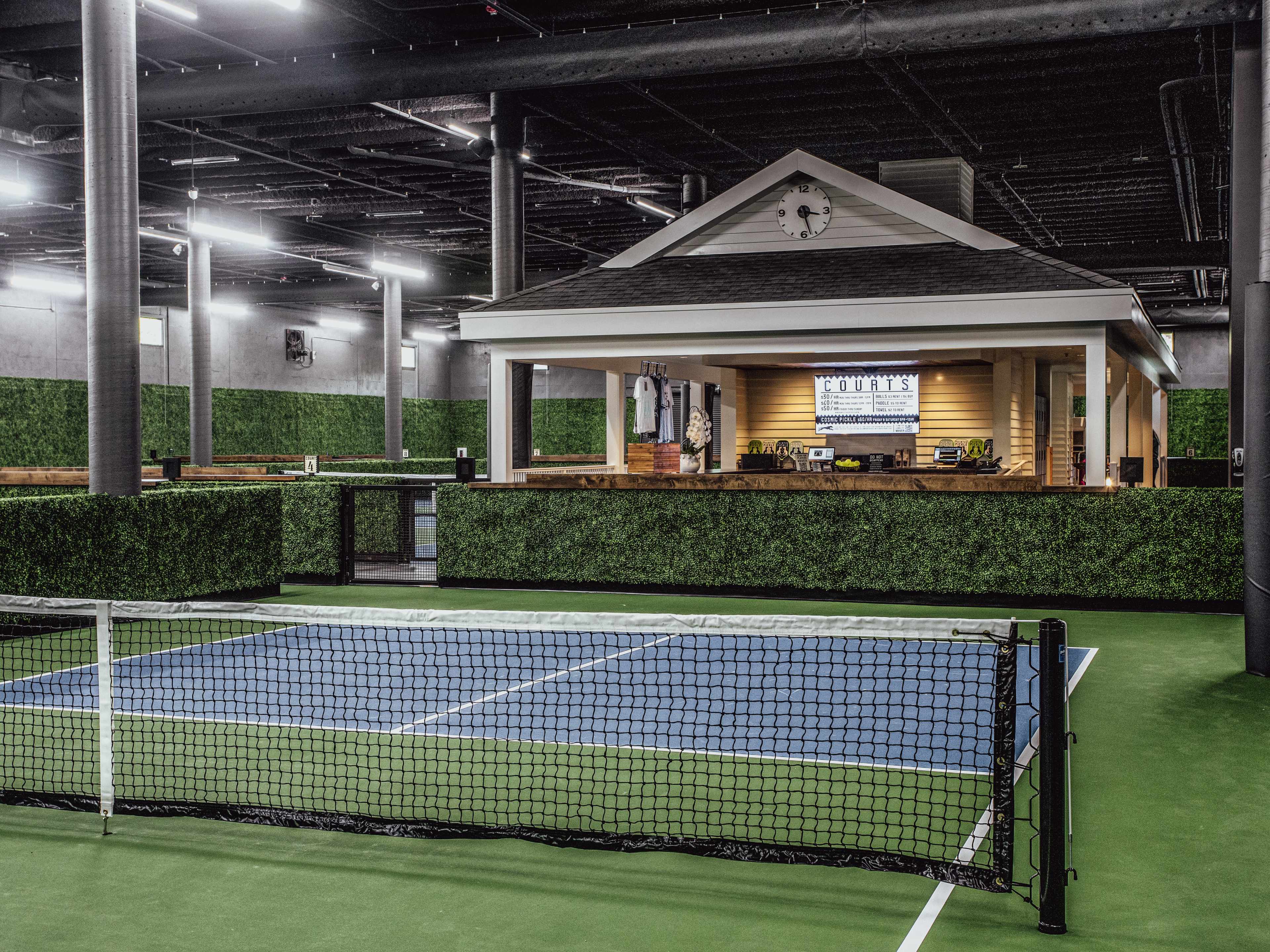 Pickle ball court with bar in the background.