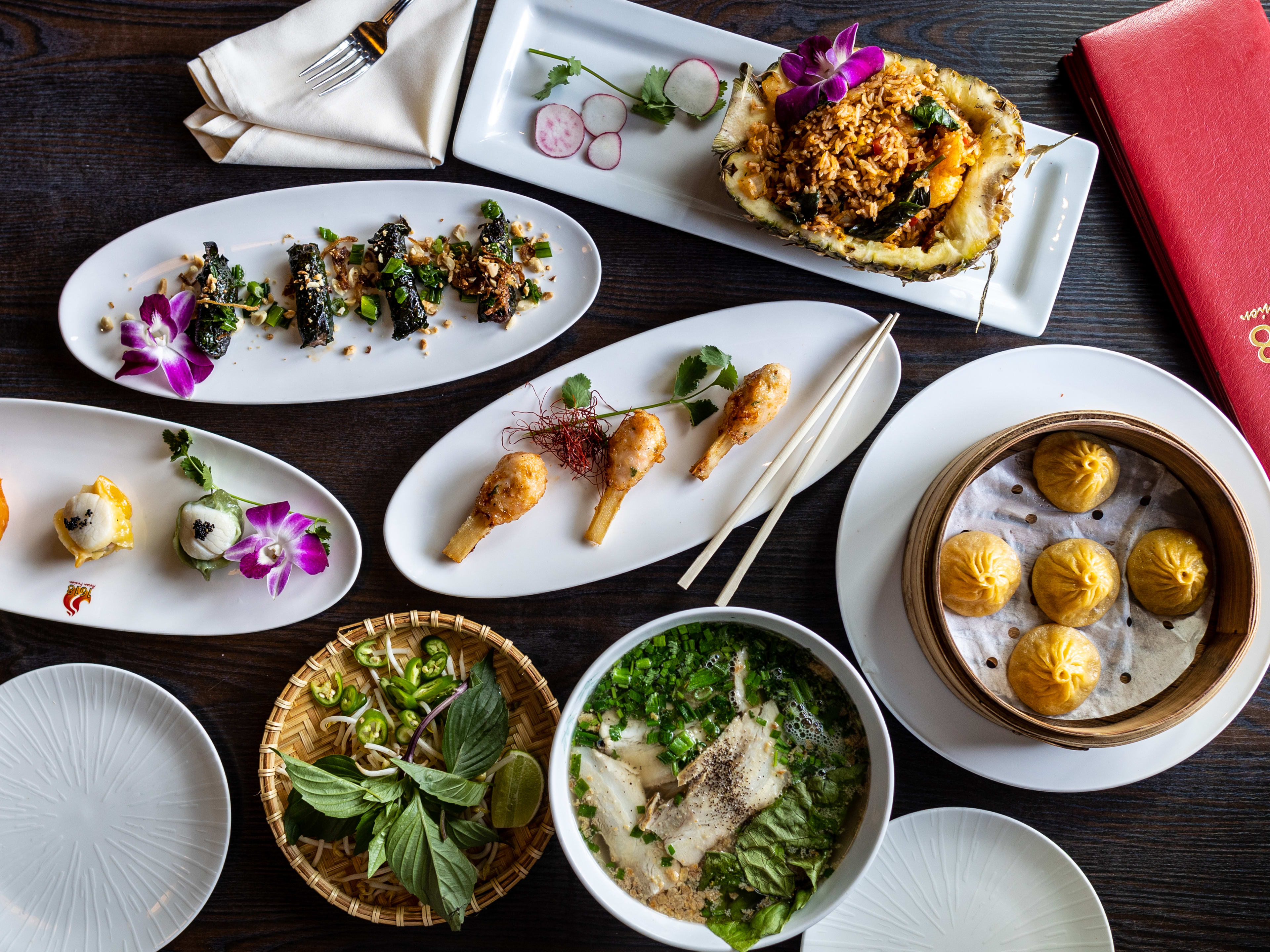 A spread of various dishes on white plates from 1618.