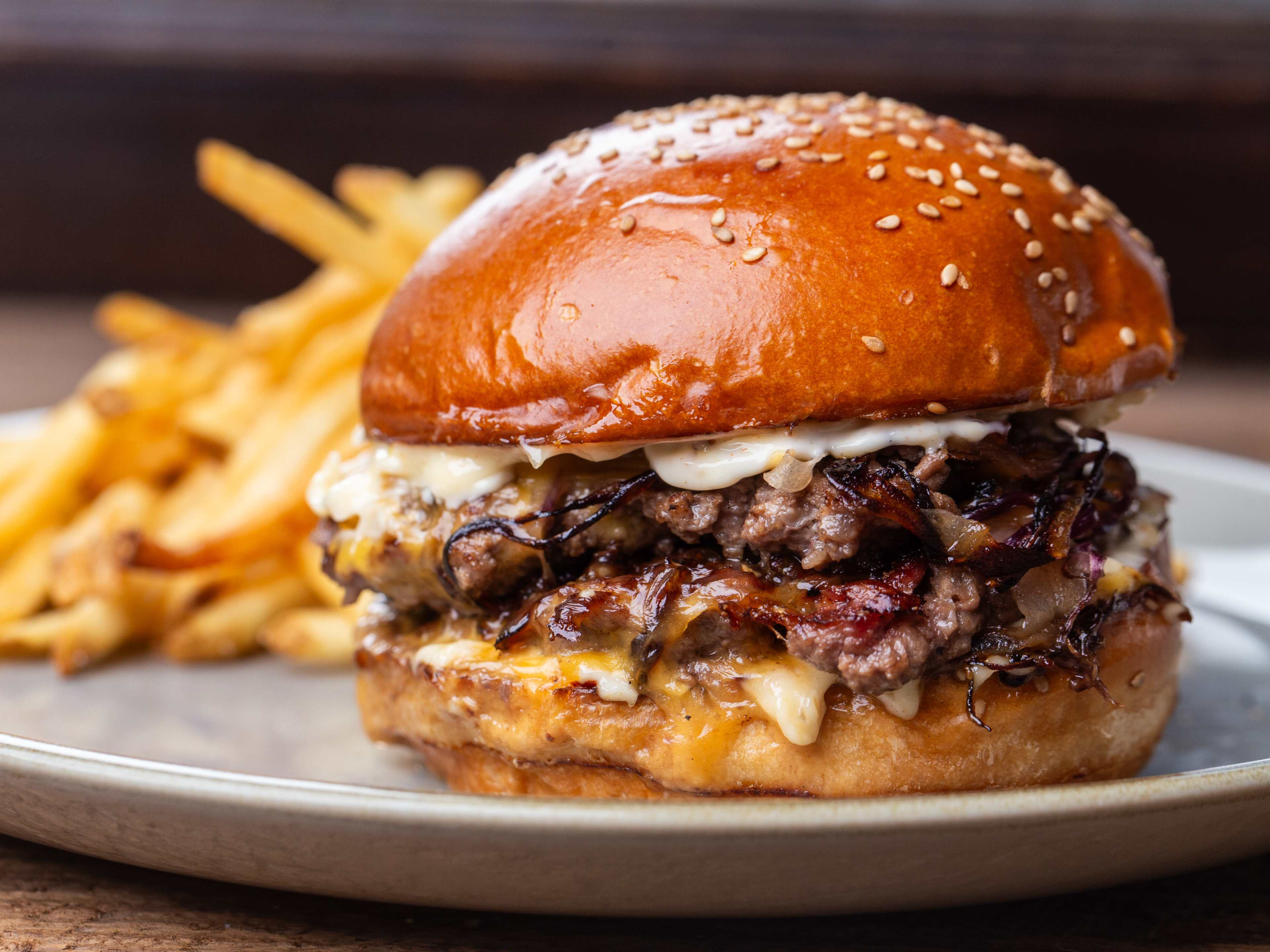 A cheeseburger and fries from 1891 American Eatery & Bar.