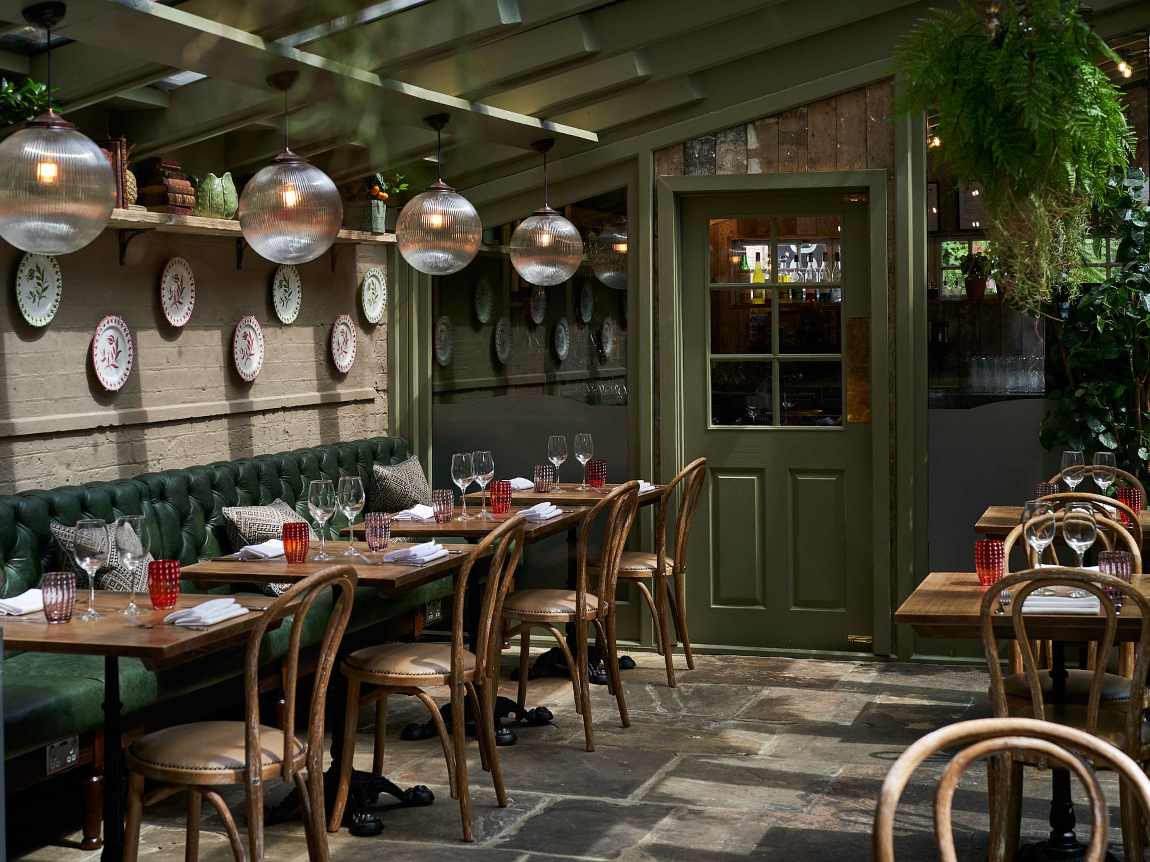 Stanley's rustic dining room with green walls and wooden details