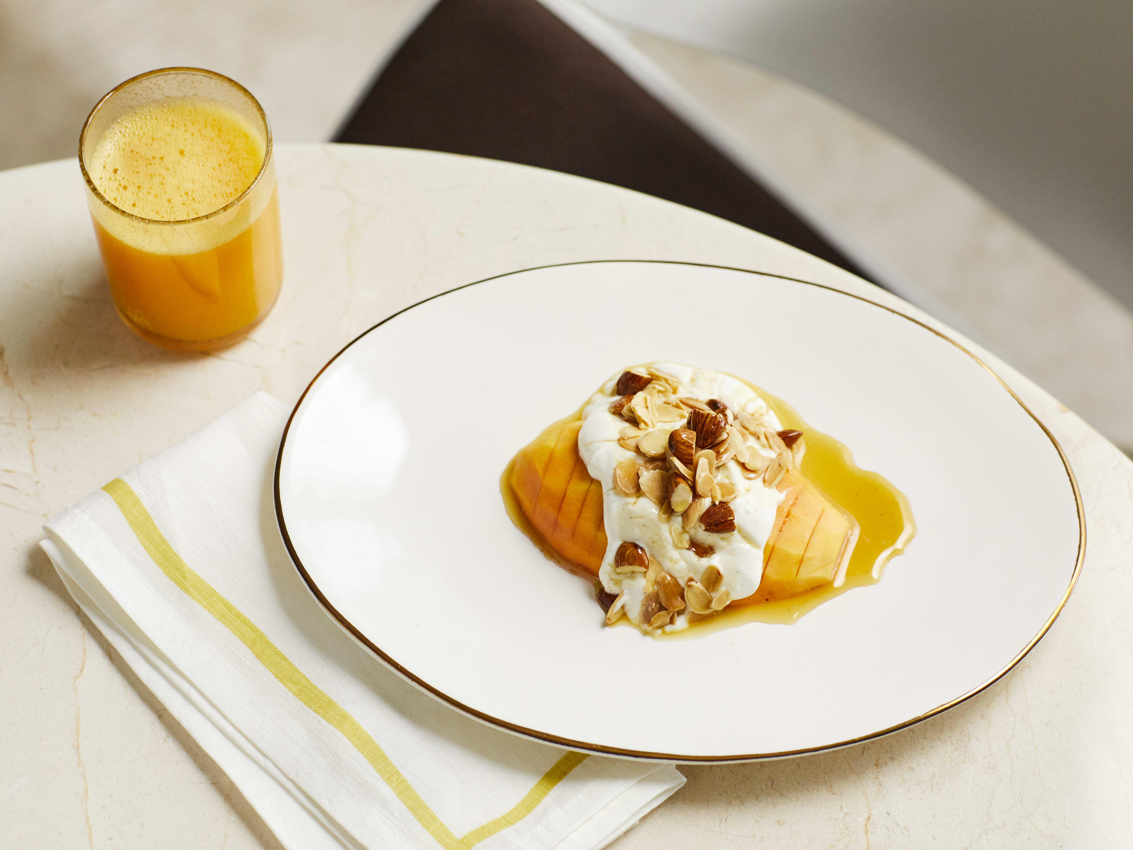 A mango dish with a juice at Tashas.