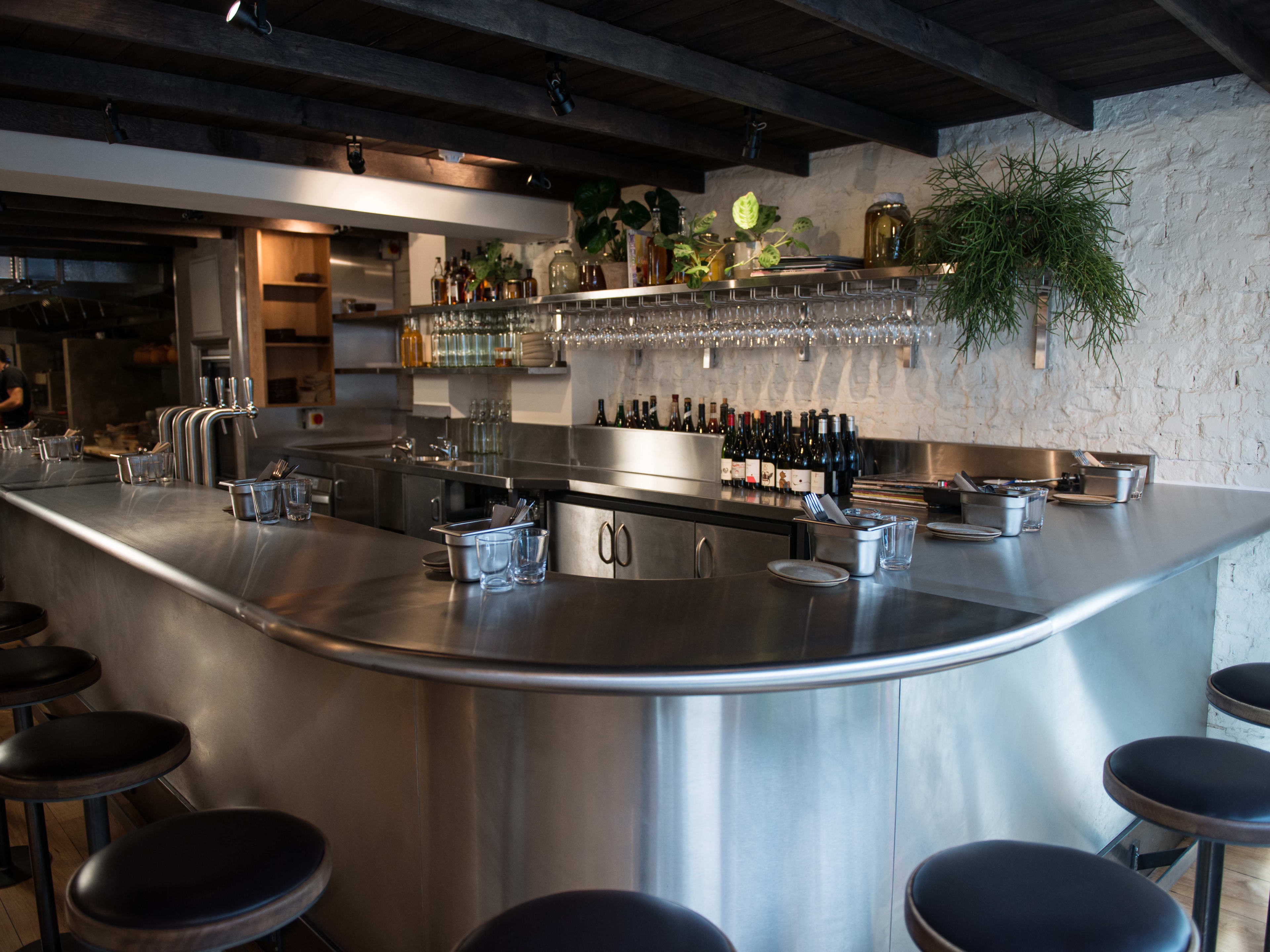 The stainless steel counter at Kiln.