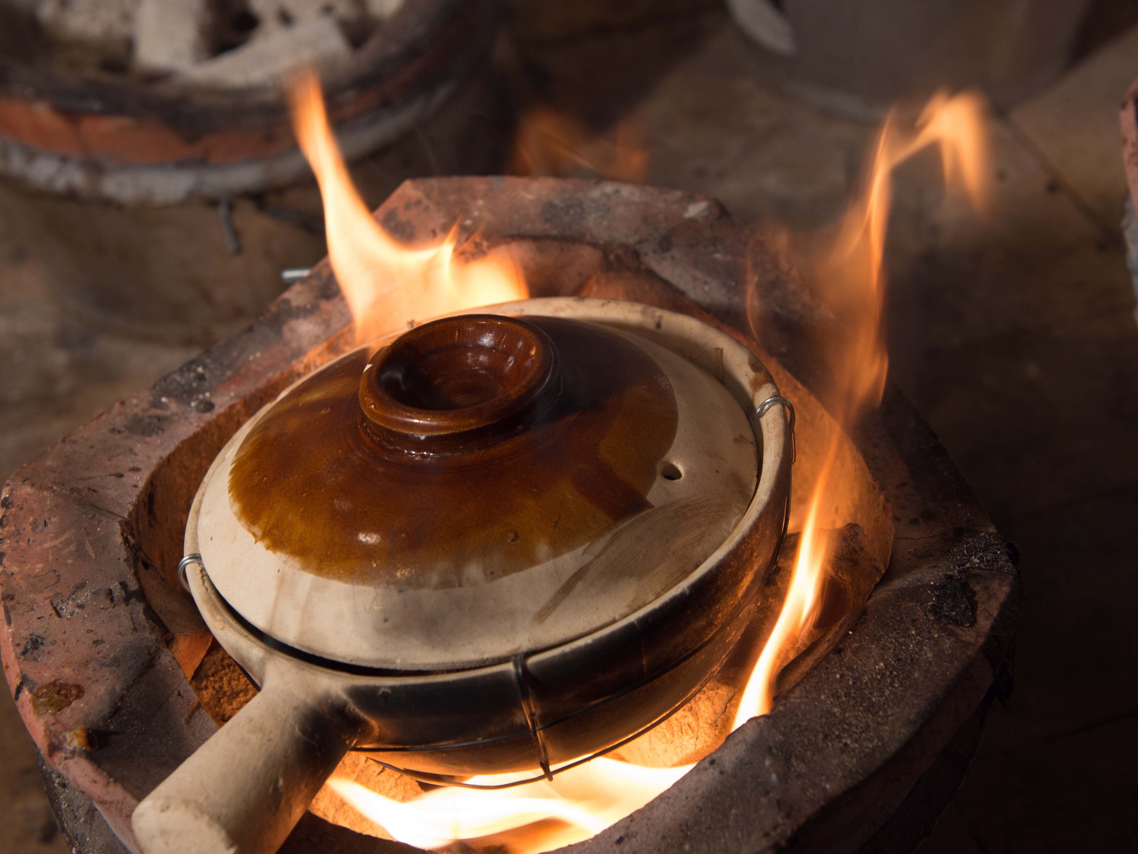 Clay pot sizzling on the fire at Kiln.