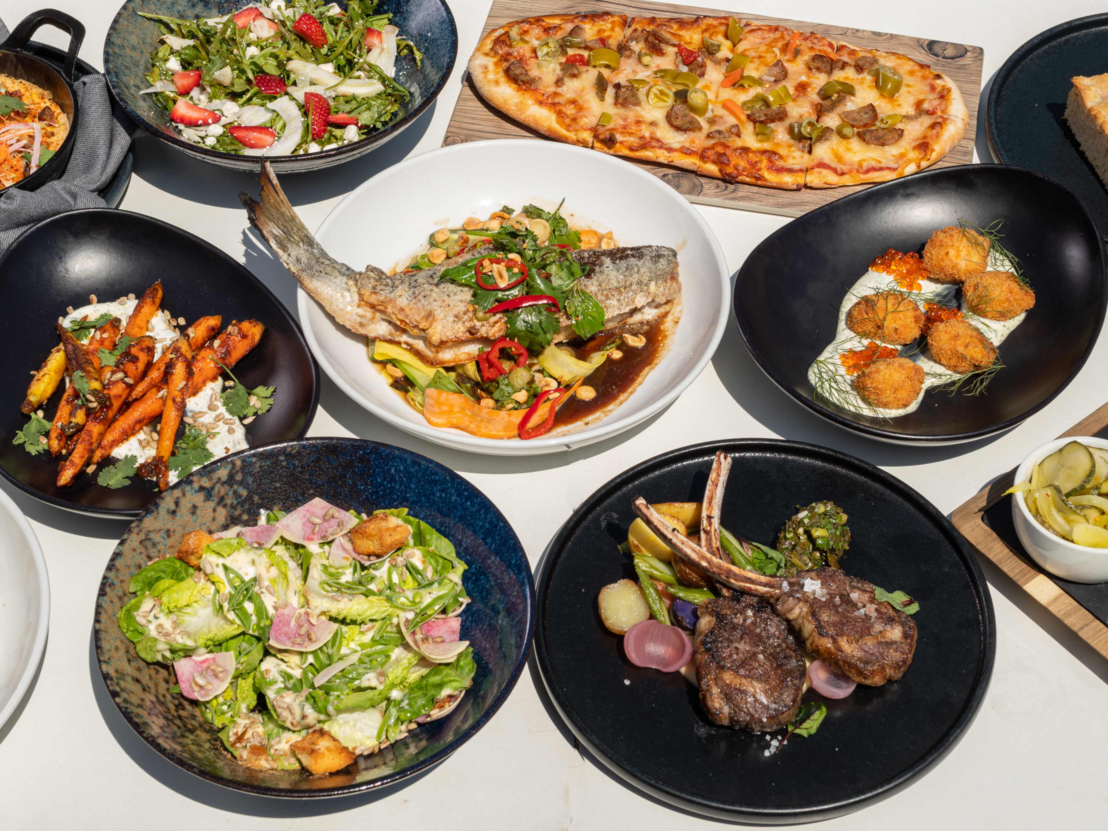 A spread of dishes from Vu Rooftop.