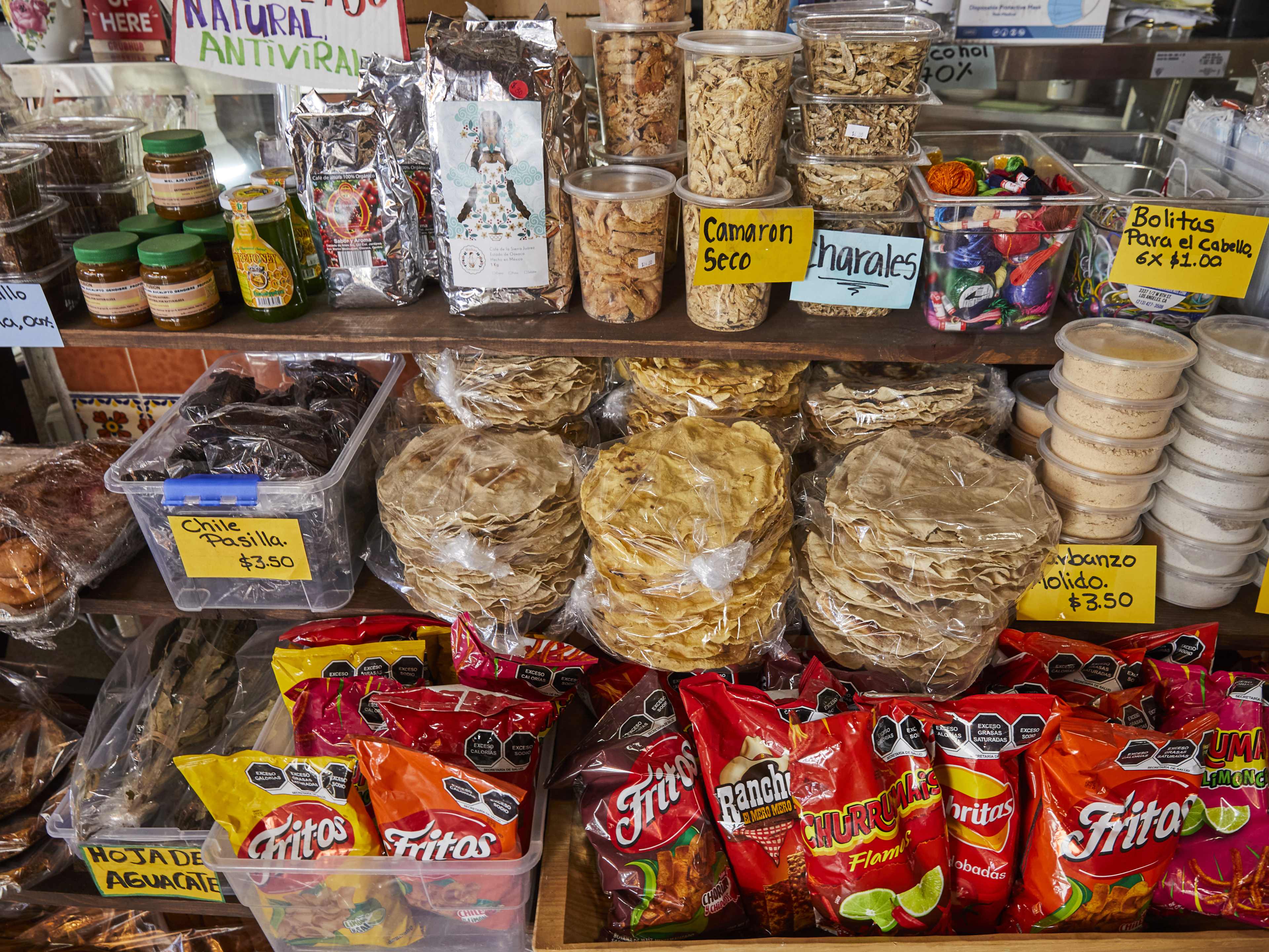 A variety of grocery items on shelves at Sabores Oaxaqueños.