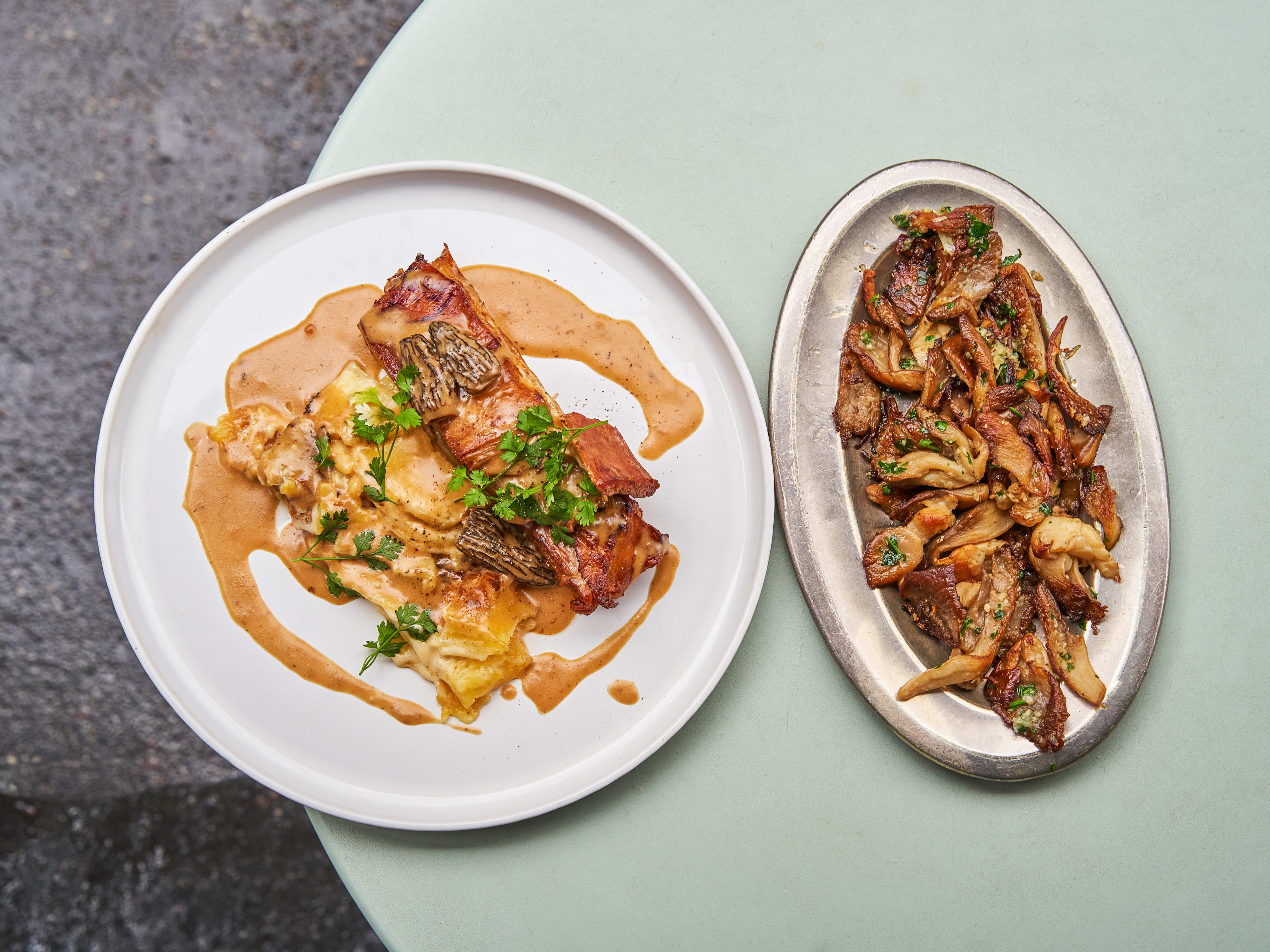 Small dishes on light green table at Au Moulin a Vent